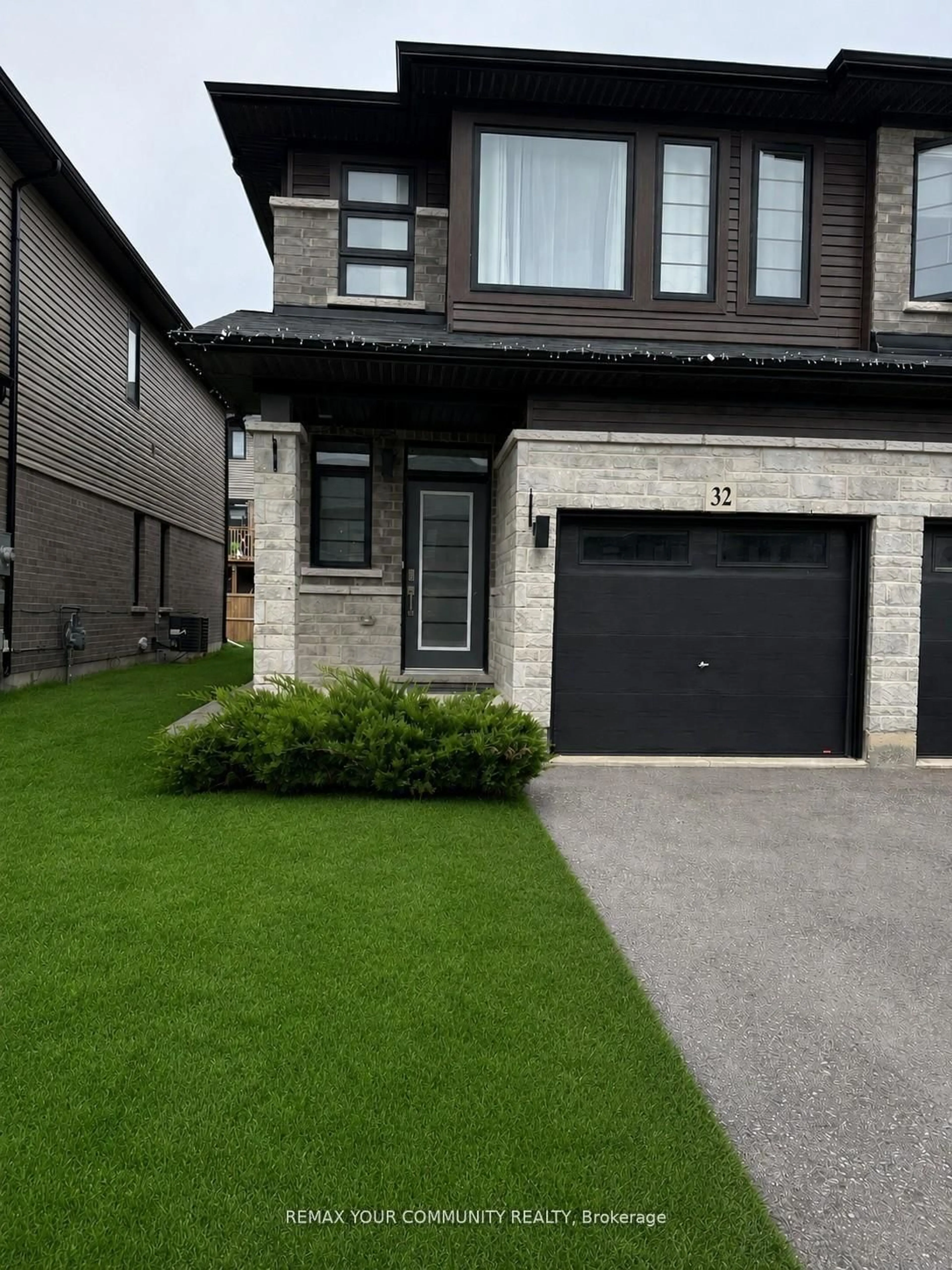 Home with brick exterior material, street for 32 June Callwood Way, Brantford Ontario N3T 0T7