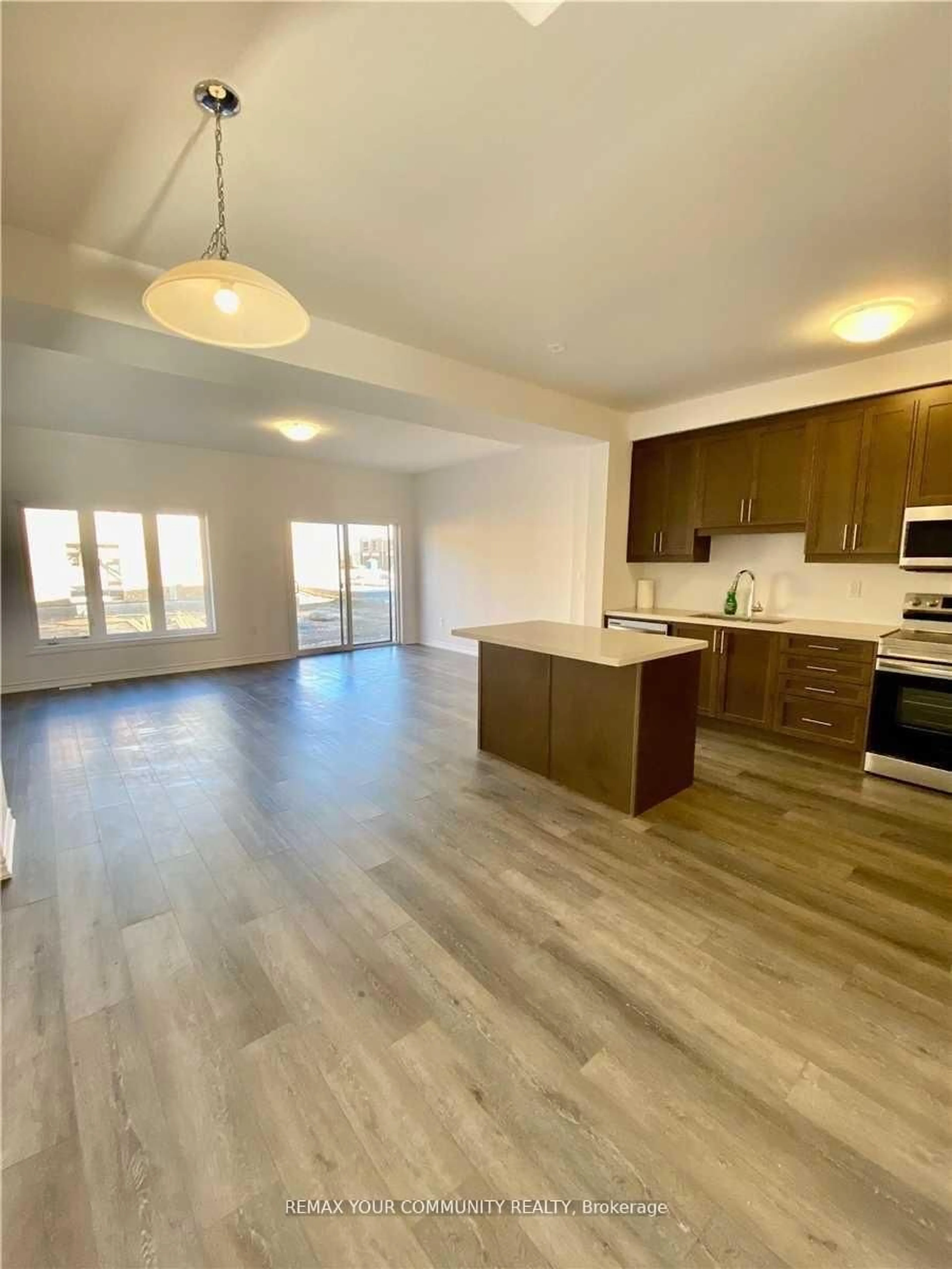 Open concept kitchen, wood/laminate floor for 32 June Callwood Way, Brantford Ontario N3T 0T7