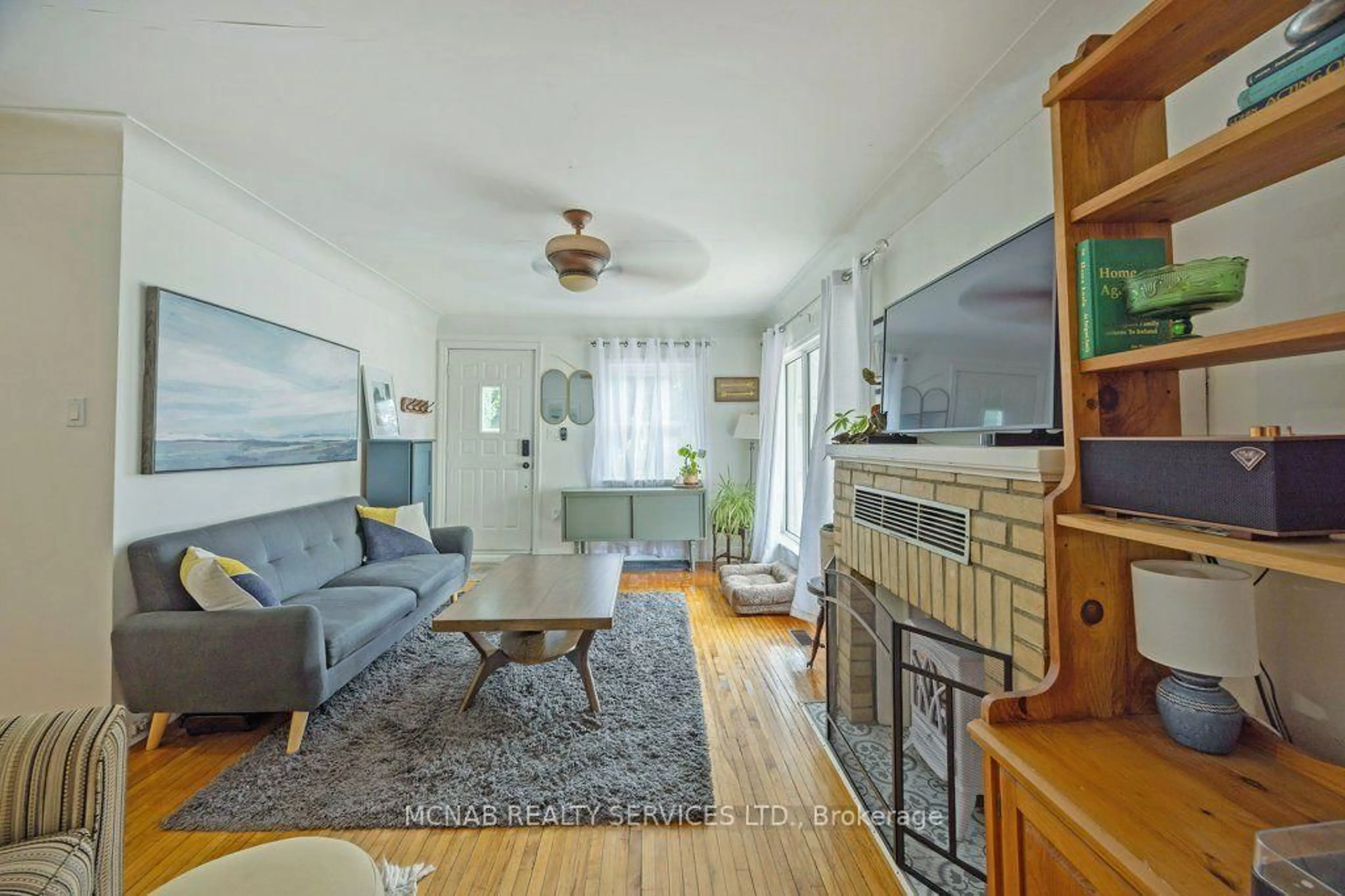 Living room with furniture, wood/laminate floor for 52 Broadway Ave, London South Ontario N6P 1A8