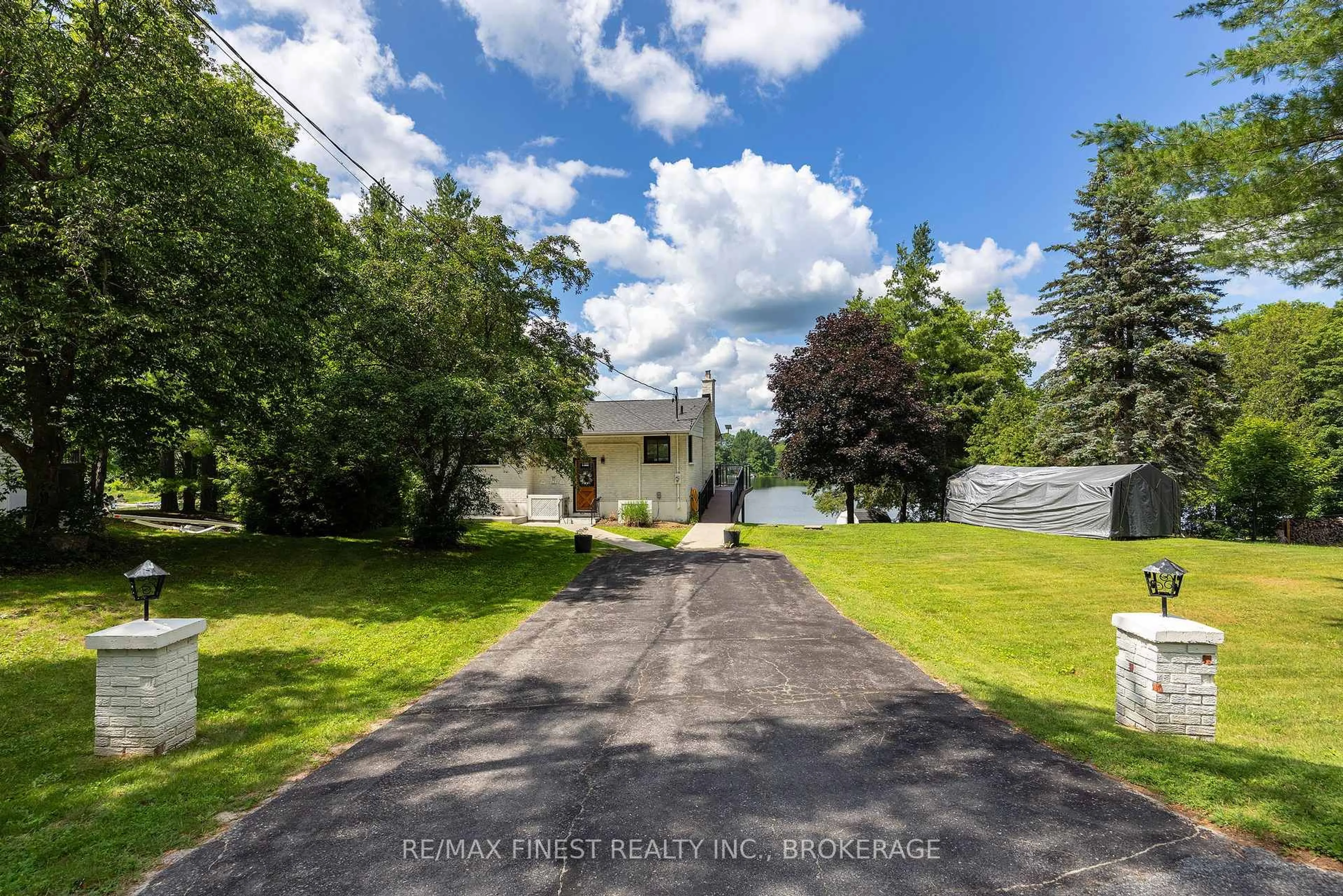 A pic from outside/outdoor area/front of a property/back of a property/a pic from drone, water/lake/river/ocean view for 4267 Maple Dr, Frontenac Ontario K0H 0B8