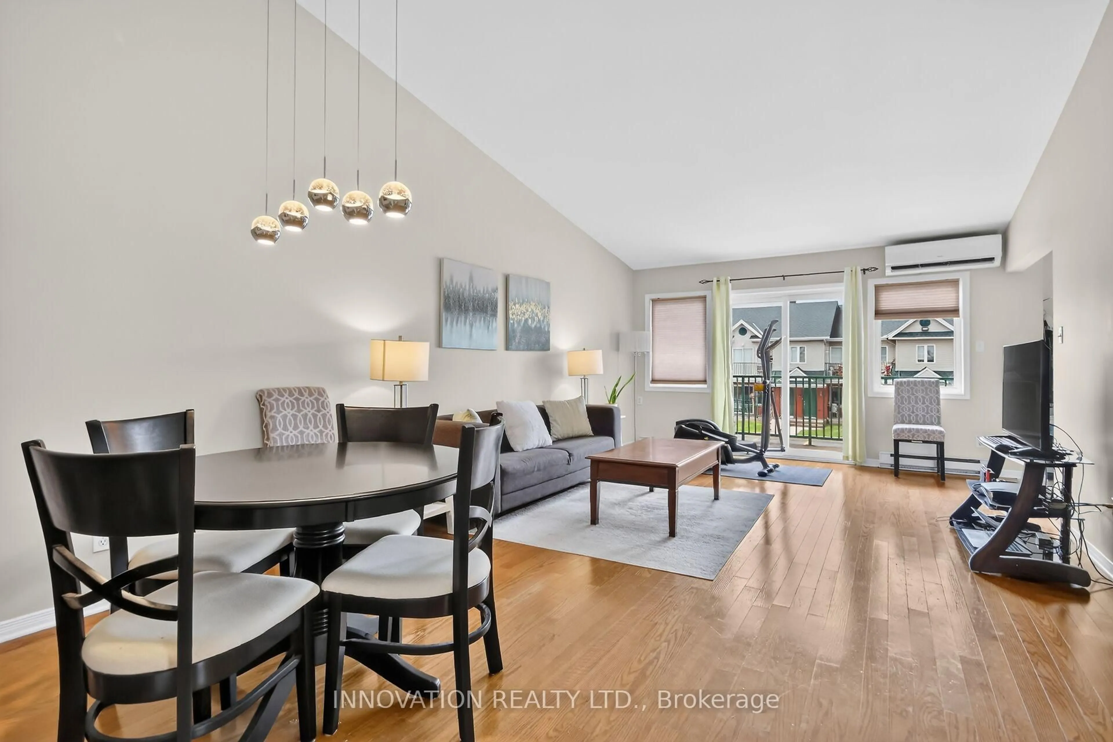 Living room with furniture, wood/laminate floor for 2923 Laurier St #408, Clarence-Rockland Ontario K4K 1T8