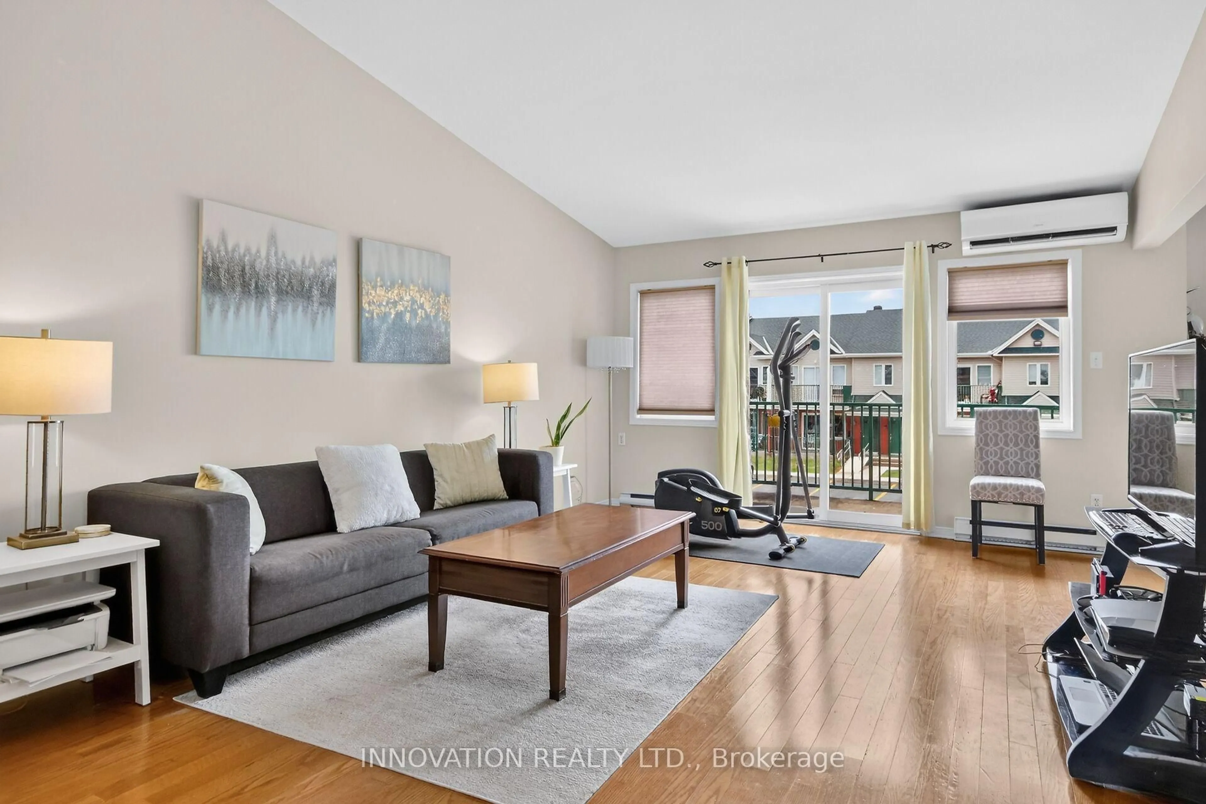 Living room with furniture, wood/laminate floor for 2923 Laurier St #408, Clarence-Rockland Ontario K4K 1T8