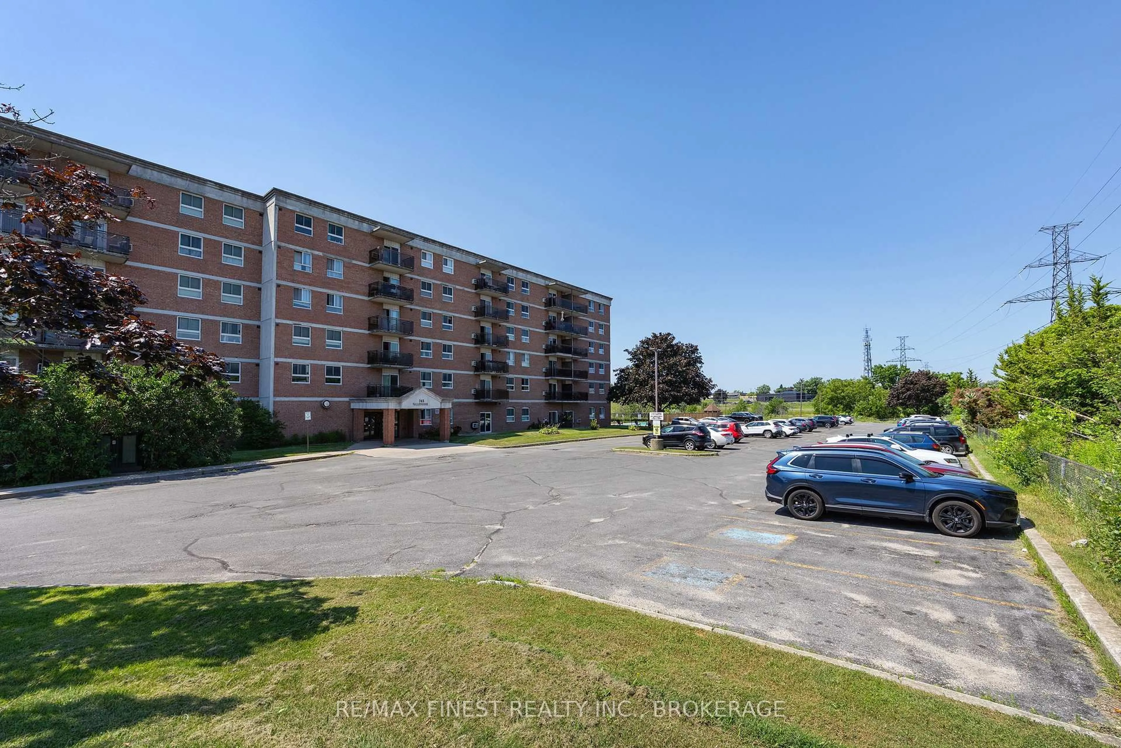 A pic from outside/outdoor area/front of a property/back of a property/a pic from drone, street for 745 Davis Dr #101, Kingston Ontario K7M 8J4