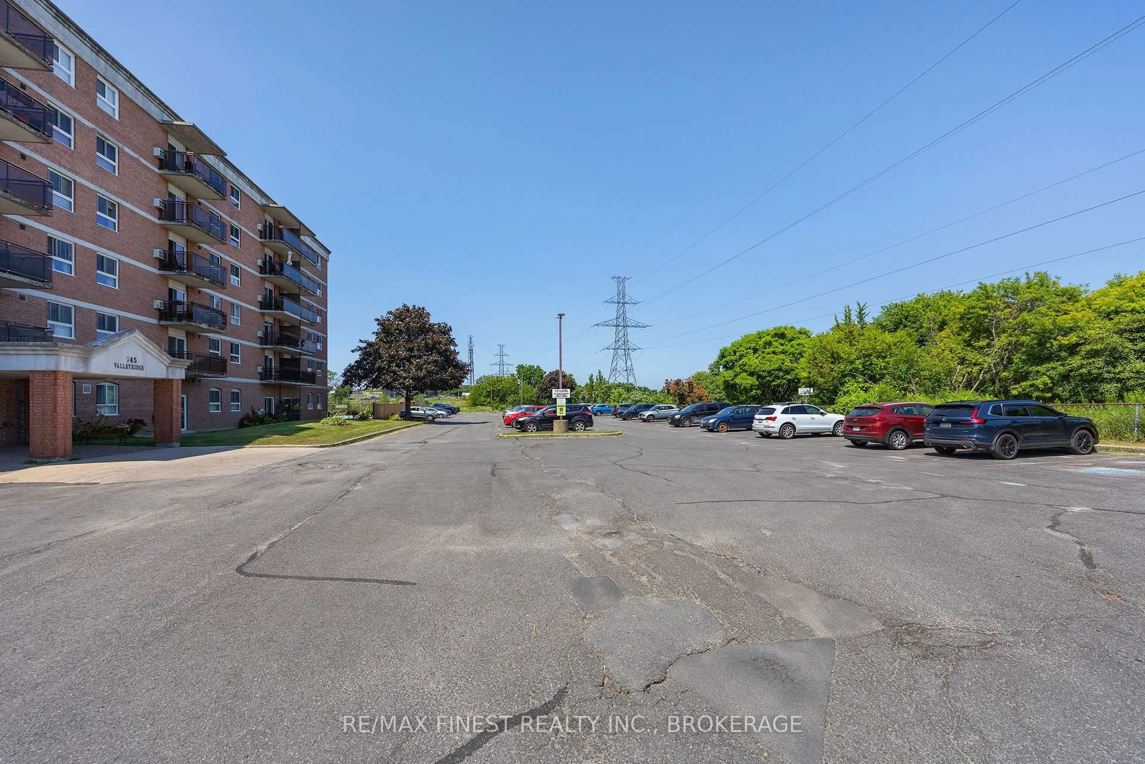 A pic from outside/outdoor area/front of a property/back of a property/a pic from drone, street for 745 Davis Dr #101, Kingston Ontario K7M 8J4