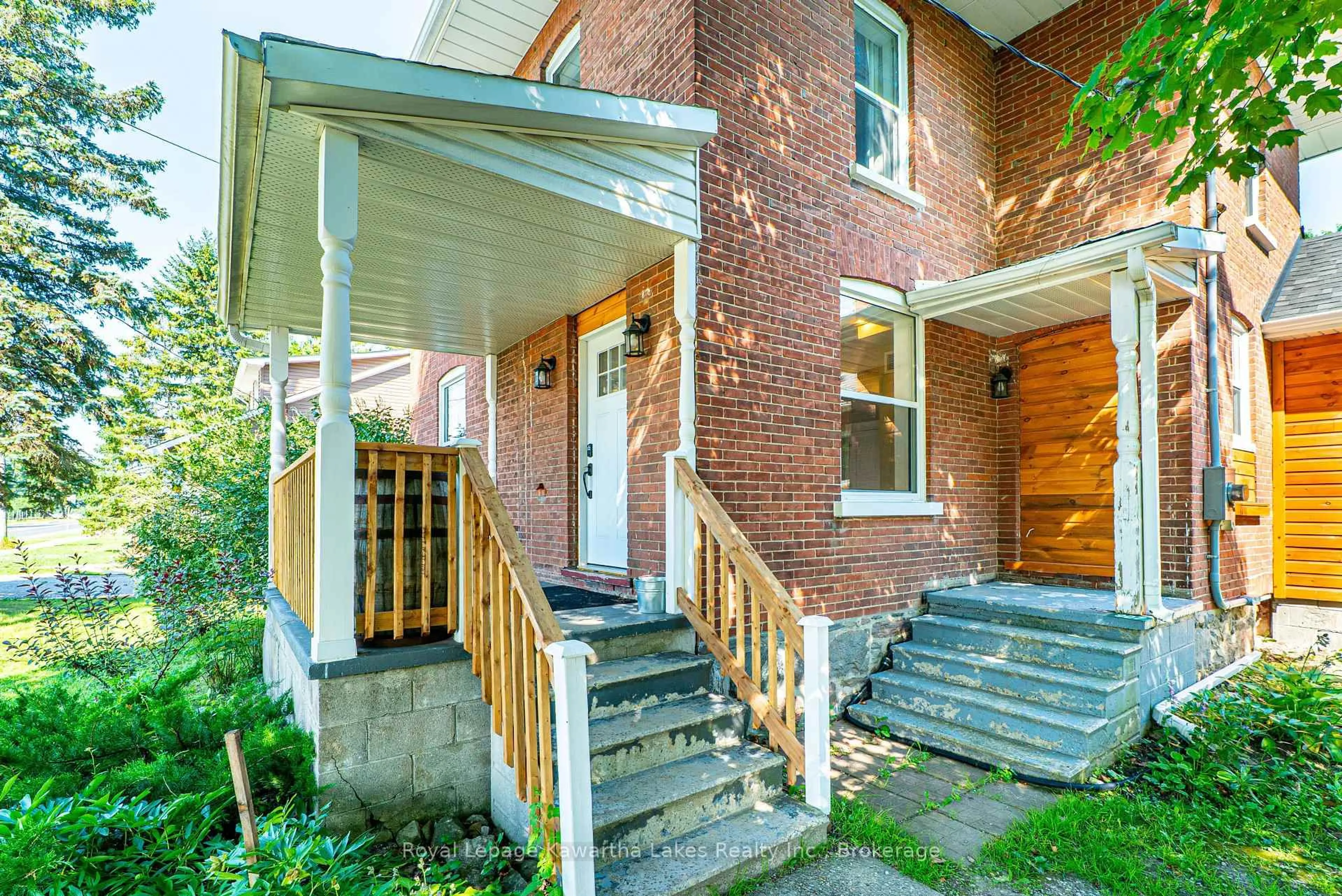 Home with brick exterior material, street for 907 HIGHWAY 7, Kawartha Lakes Ontario K0M 2M0