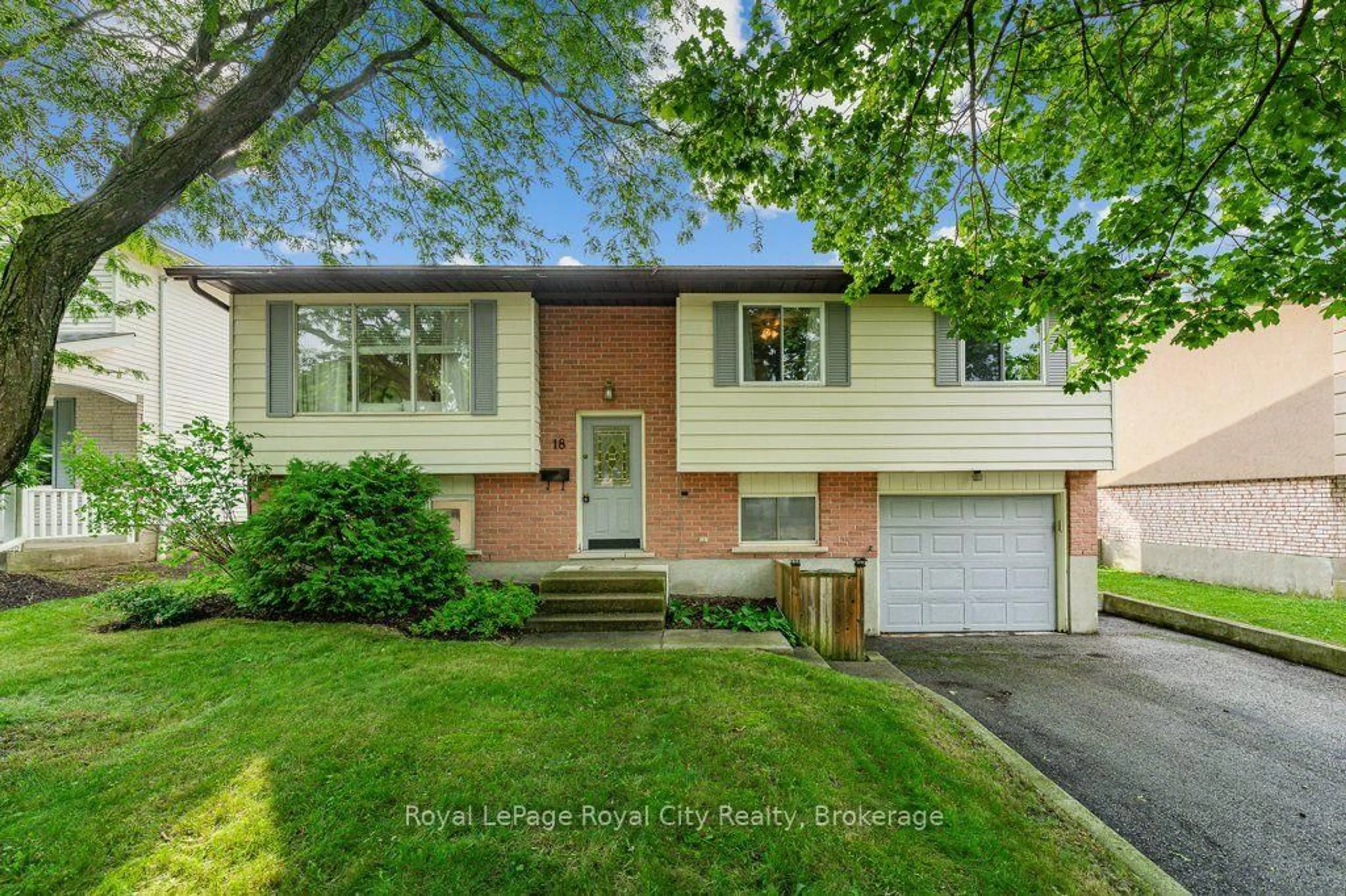 Home with vinyl exterior material, street for 18 Springdale Blvd, Guelph Ontario N1H 6X5