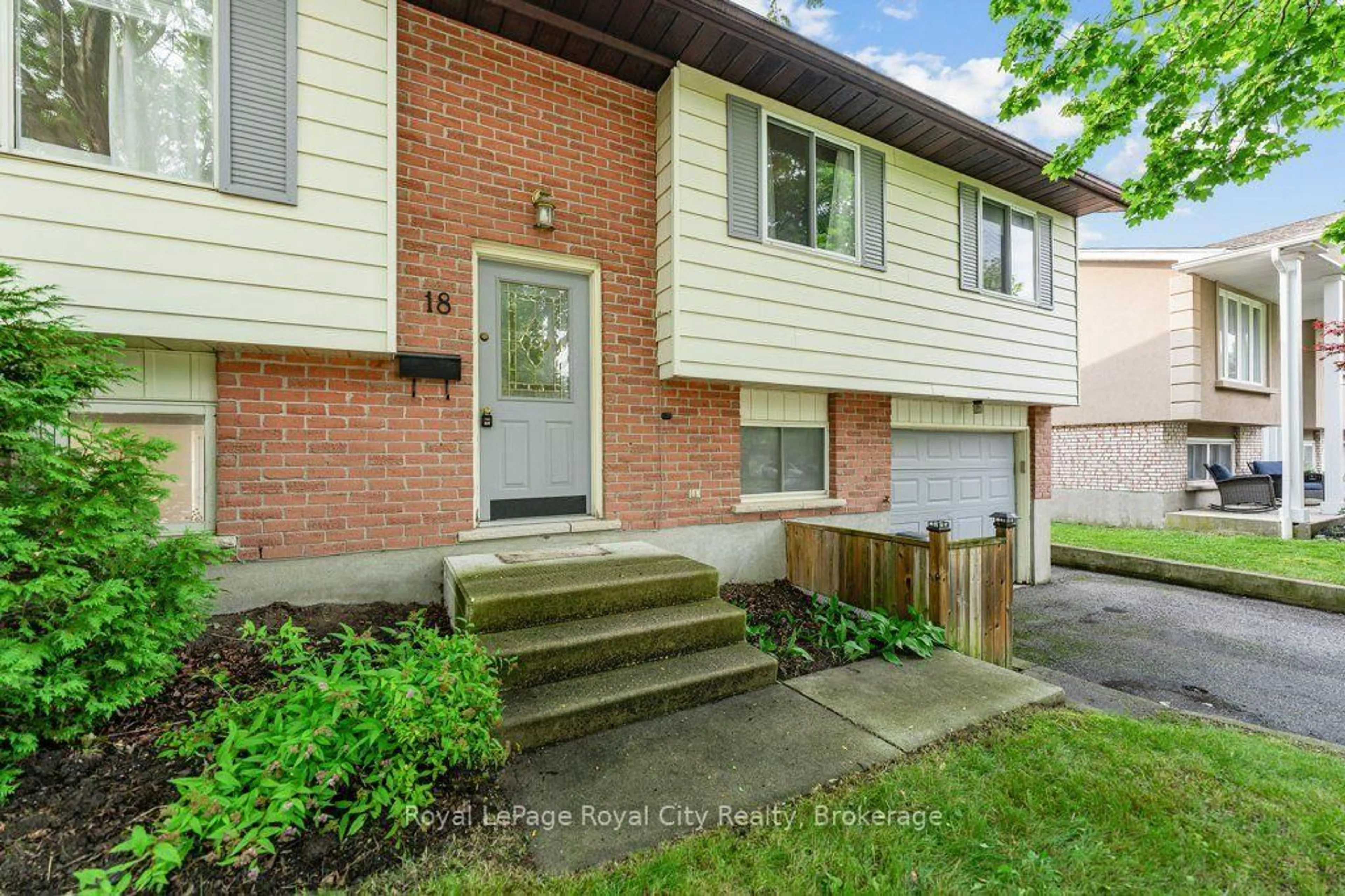 Home with brick exterior material, street for 18 Springdale Blvd, Guelph Ontario N1H 6X5