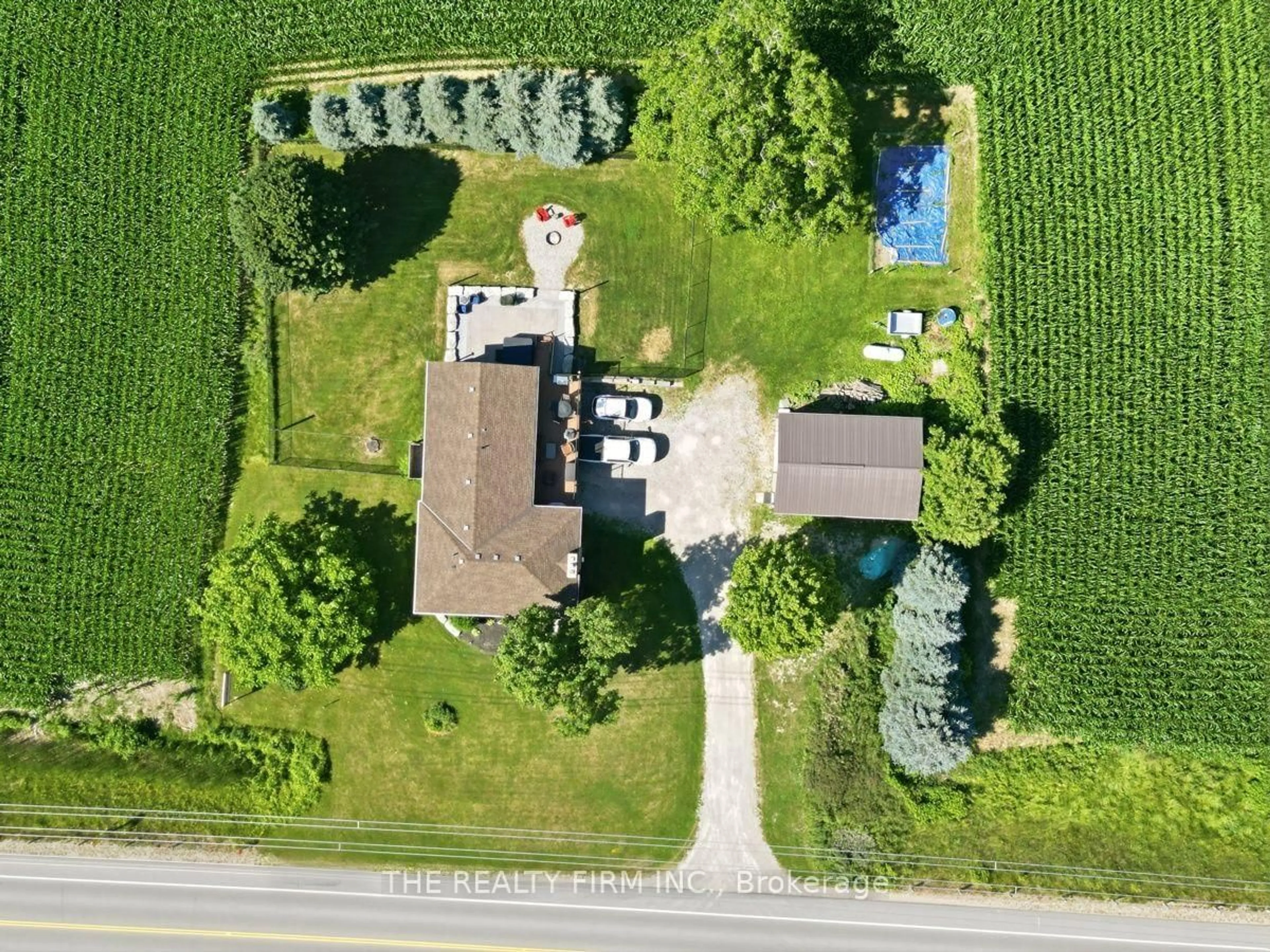 A pic from outside/outdoor area/front of a property/back of a property/a pic from drone, street for 808 Elginfield Rd, North Middlesex Ontario N0M 2K0