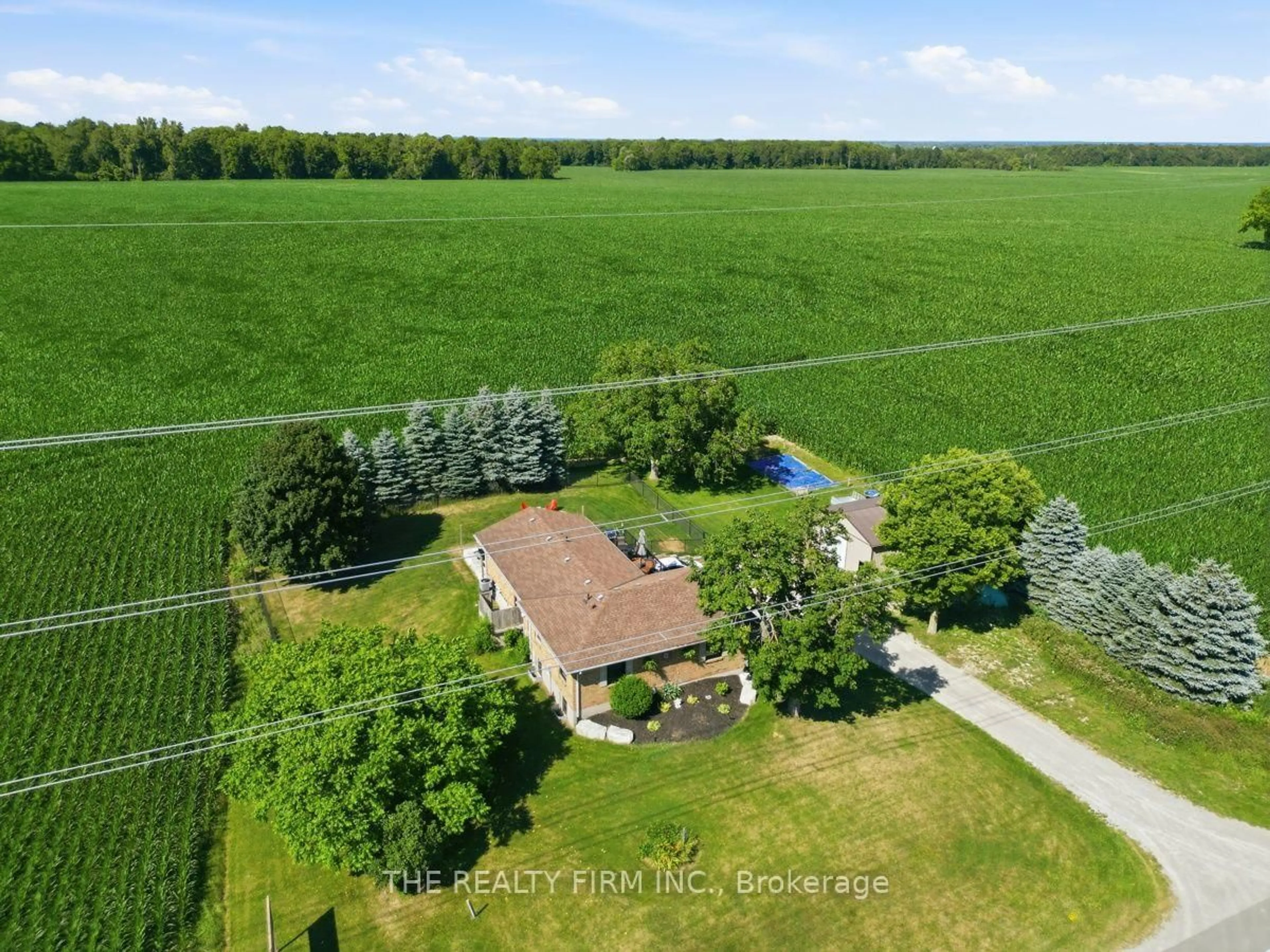 A pic from outside/outdoor area/front of a property/back of a property/a pic from drone, water/lake/river/ocean view for 808 Elginfield Rd, North Middlesex Ontario N0M 2K0