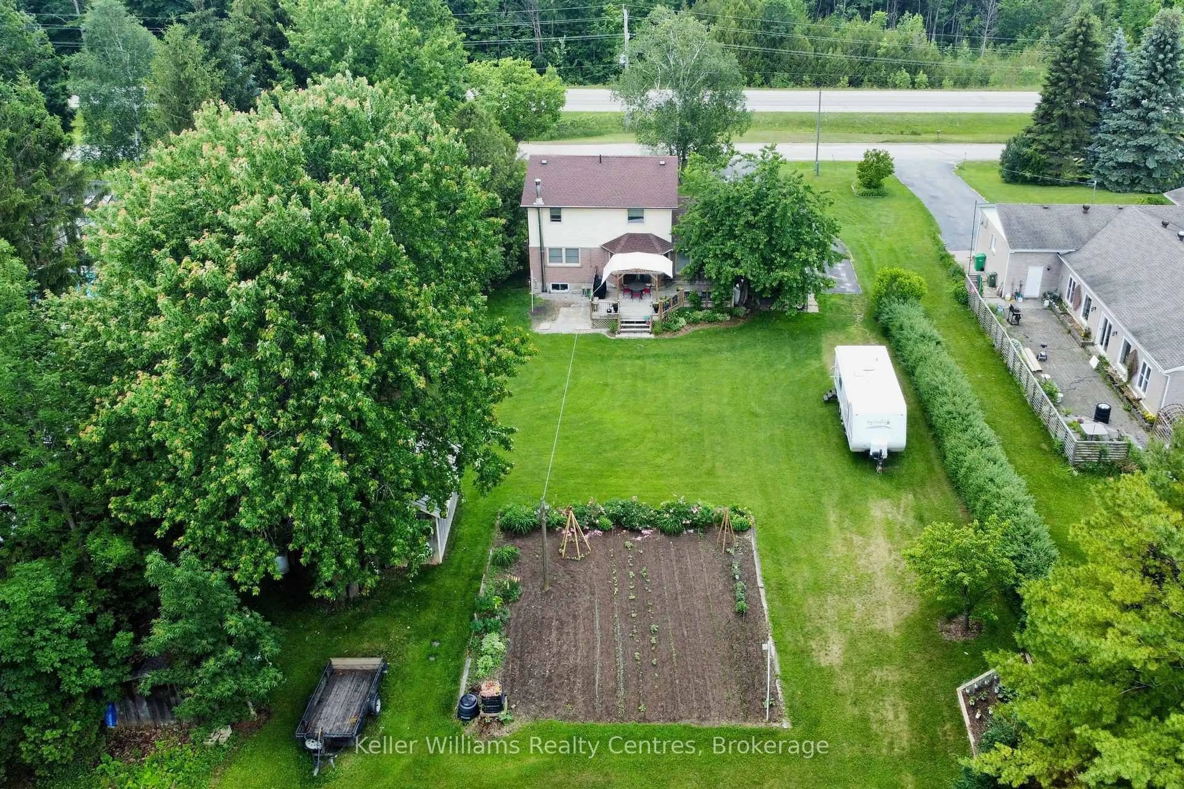 A pic from outside/outdoor area/front of a property/back of a property/a pic from drone, unknown for 129 Country Lane Rd, West Grey Ontario N0G 1S0