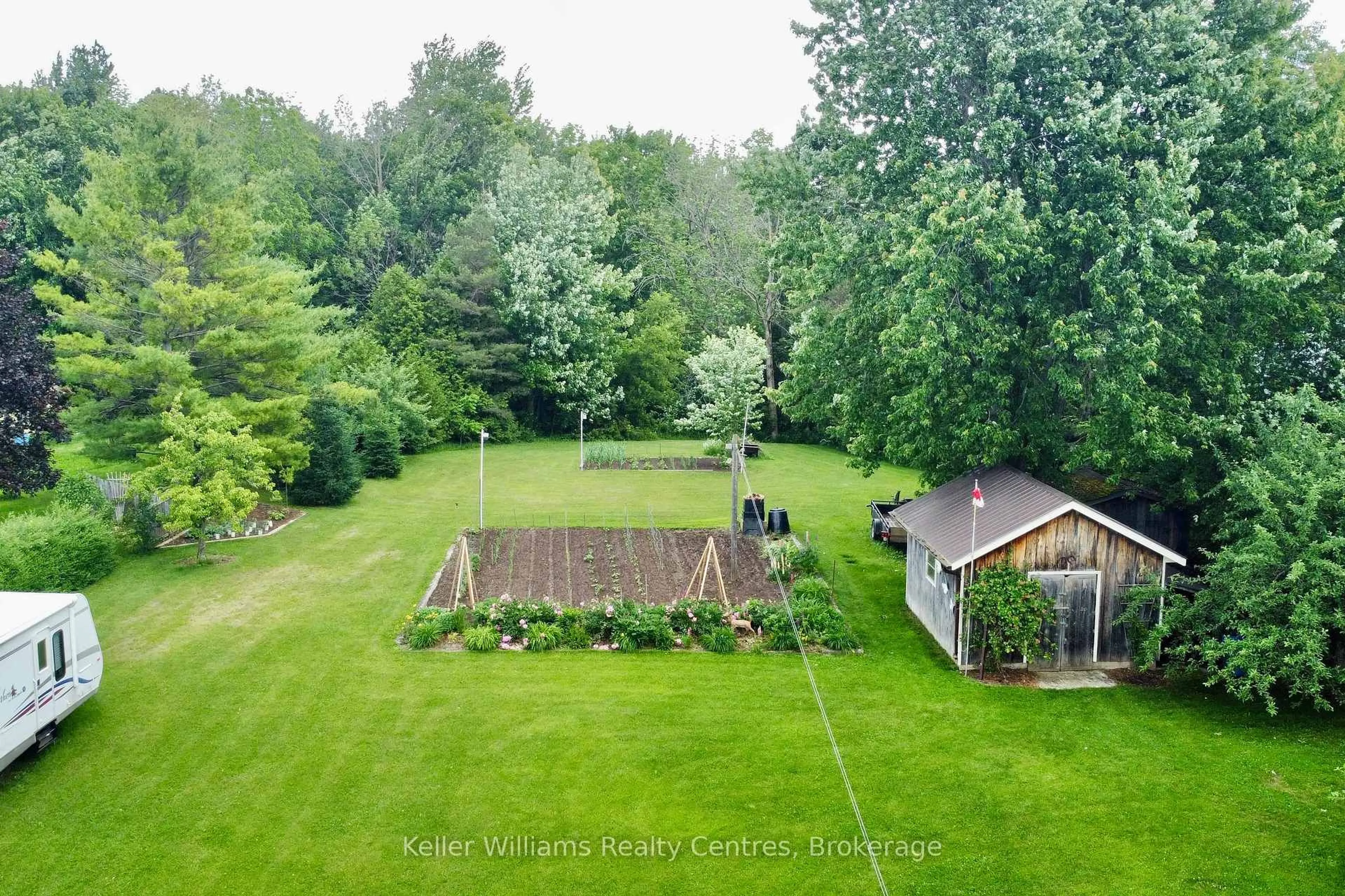 A pic from outside/outdoor area/front of a property/back of a property/a pic from drone, forest/trees view for 129 Country Lane Rd, West Grey Ontario N0G 1S0