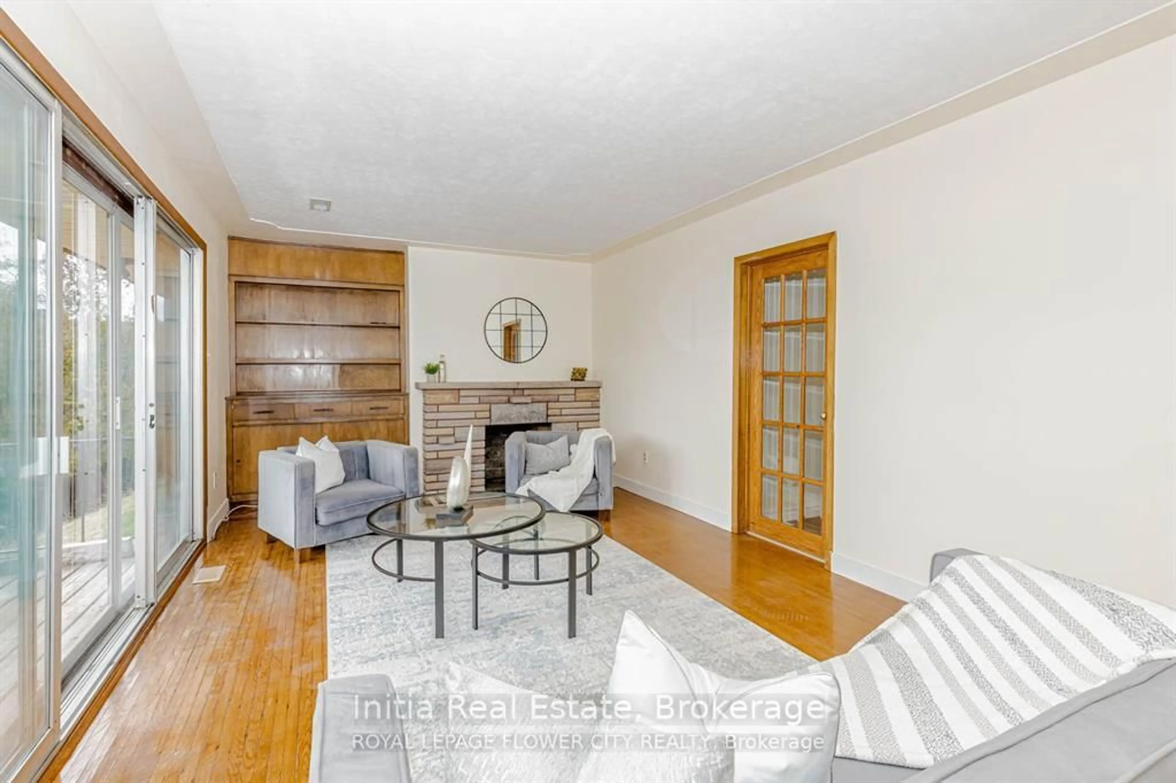 Living room with furniture, wood/laminate floor for 1421 Fanshawe Park Rd, London North Ontario N5X 3Z9