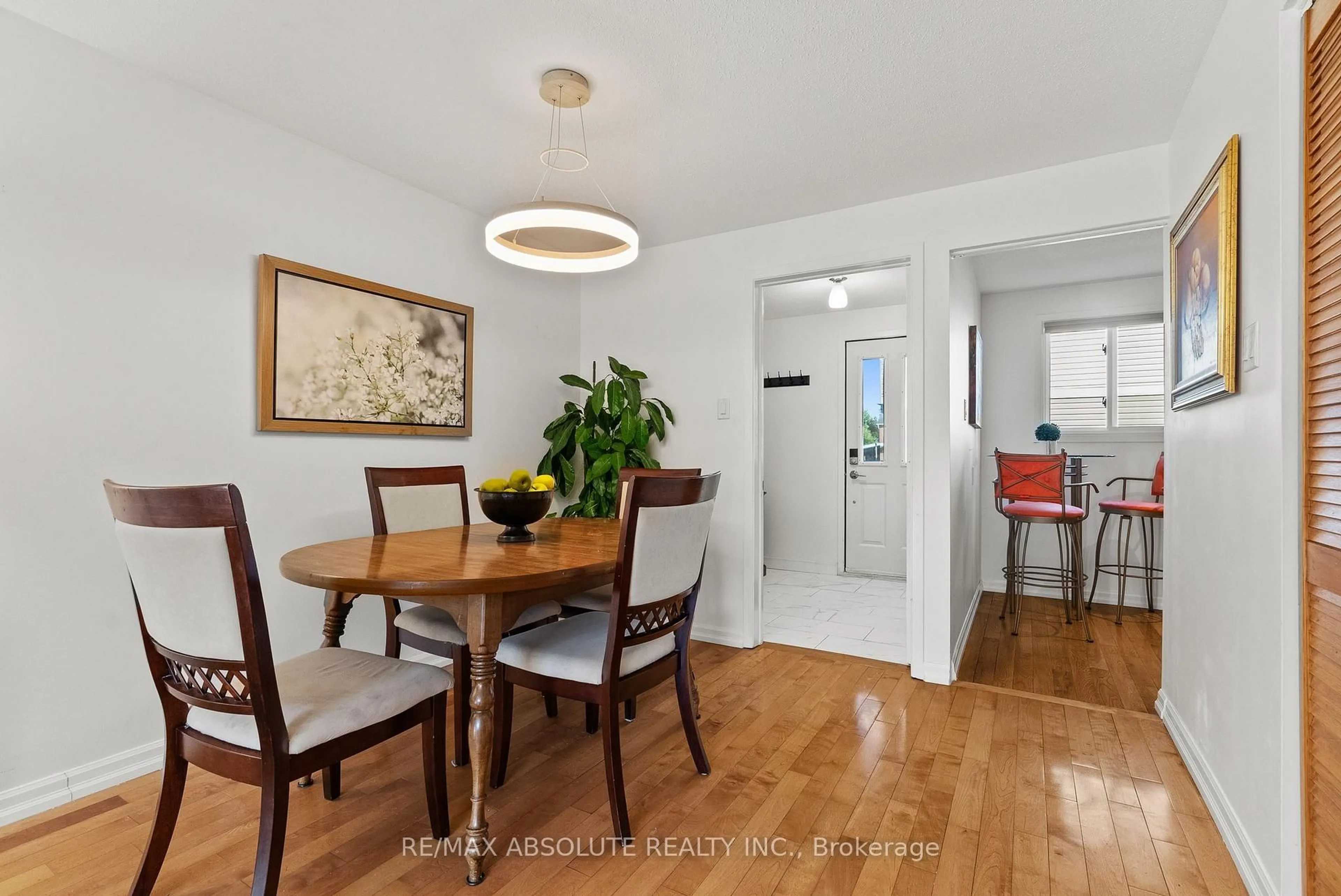 Dining room, wood/laminate floor for 413 Woodfield Dr ##D, Ottawa Ontario K2G 4B7