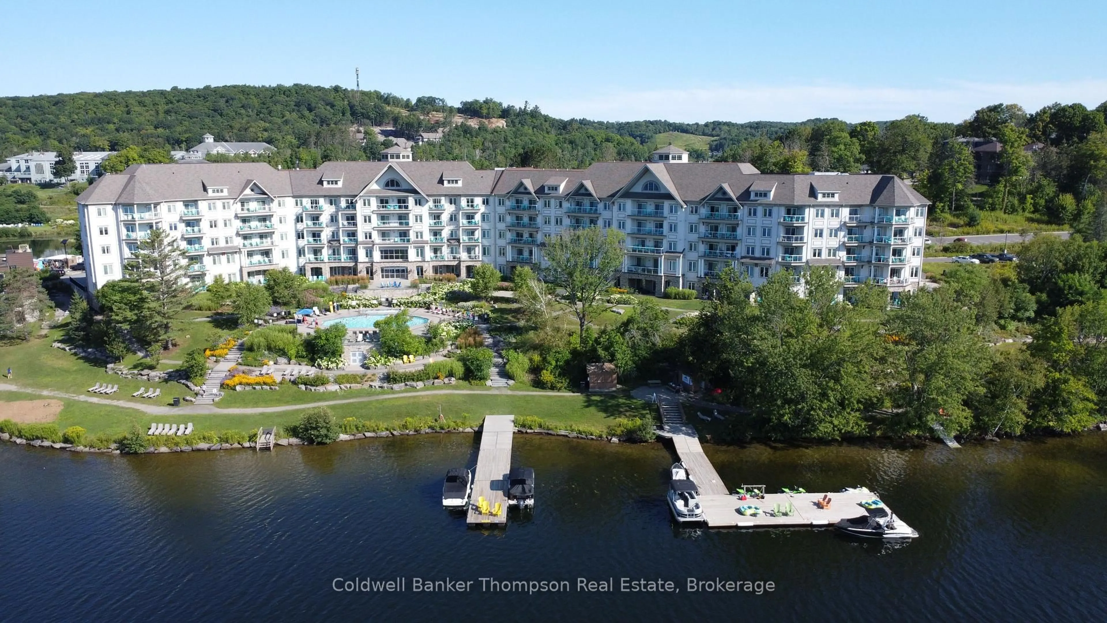 A pic from outside/outdoor area/front of a property/back of a property/a pic from drone, water/lake/river/ocean view for 25 PEN LAKE POINT Rd #403, Huntsville Ontario P1H 1A9