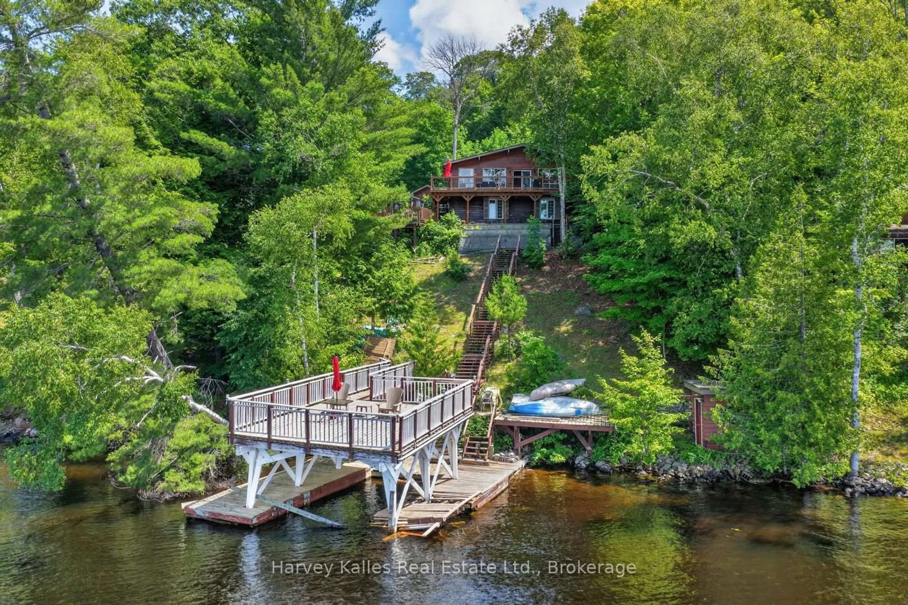 A pic from outside/outdoor area/front of a property/back of a property/a pic from drone, water/lake/river/ocean view for 260 West Point Sands Rd, Huntsville Ontario P1H 2J3