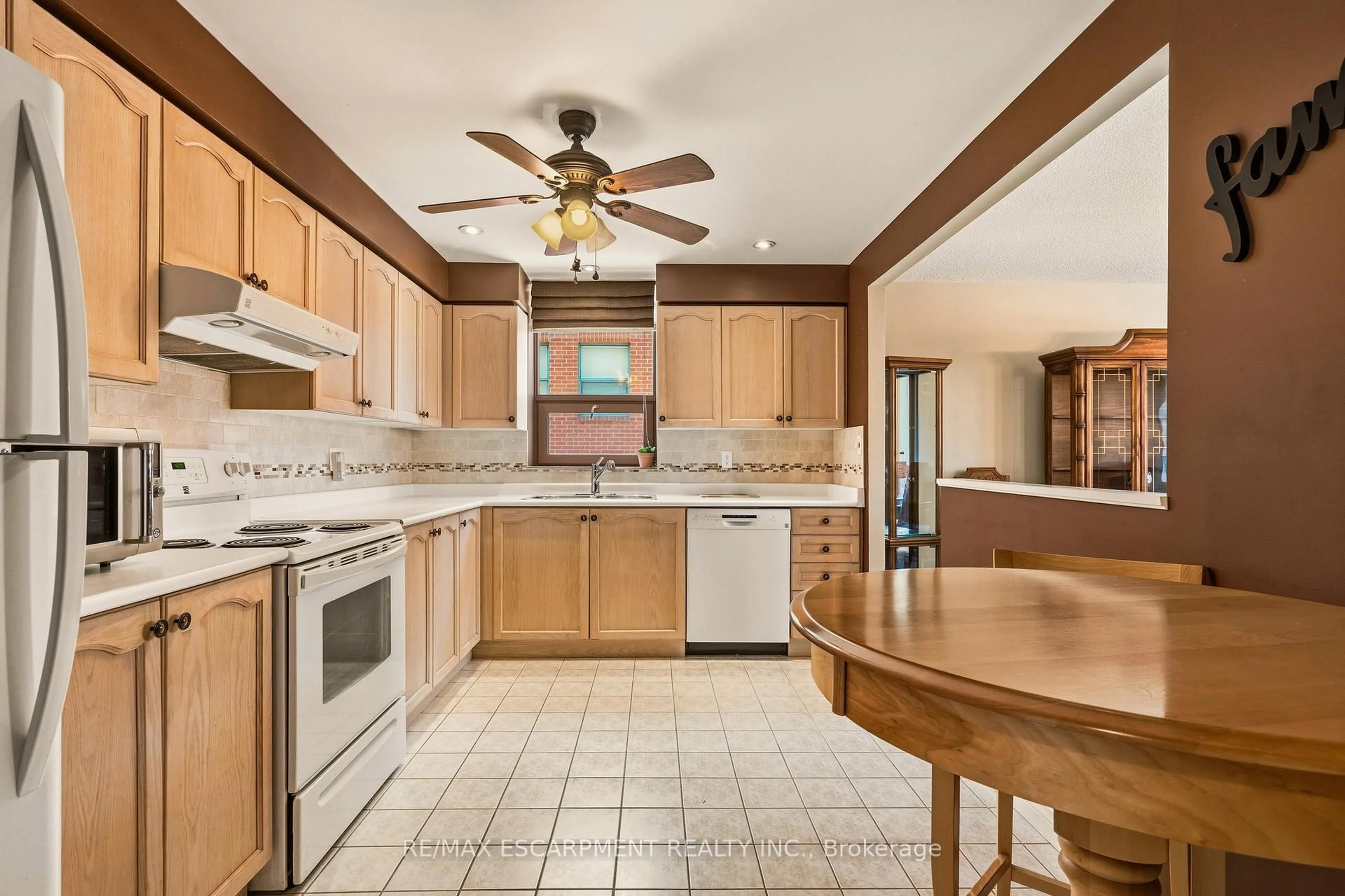 Open concept kitchen, ceramic/tile floor for 8 Main St #203, Hamilton Ontario L9H 1B8