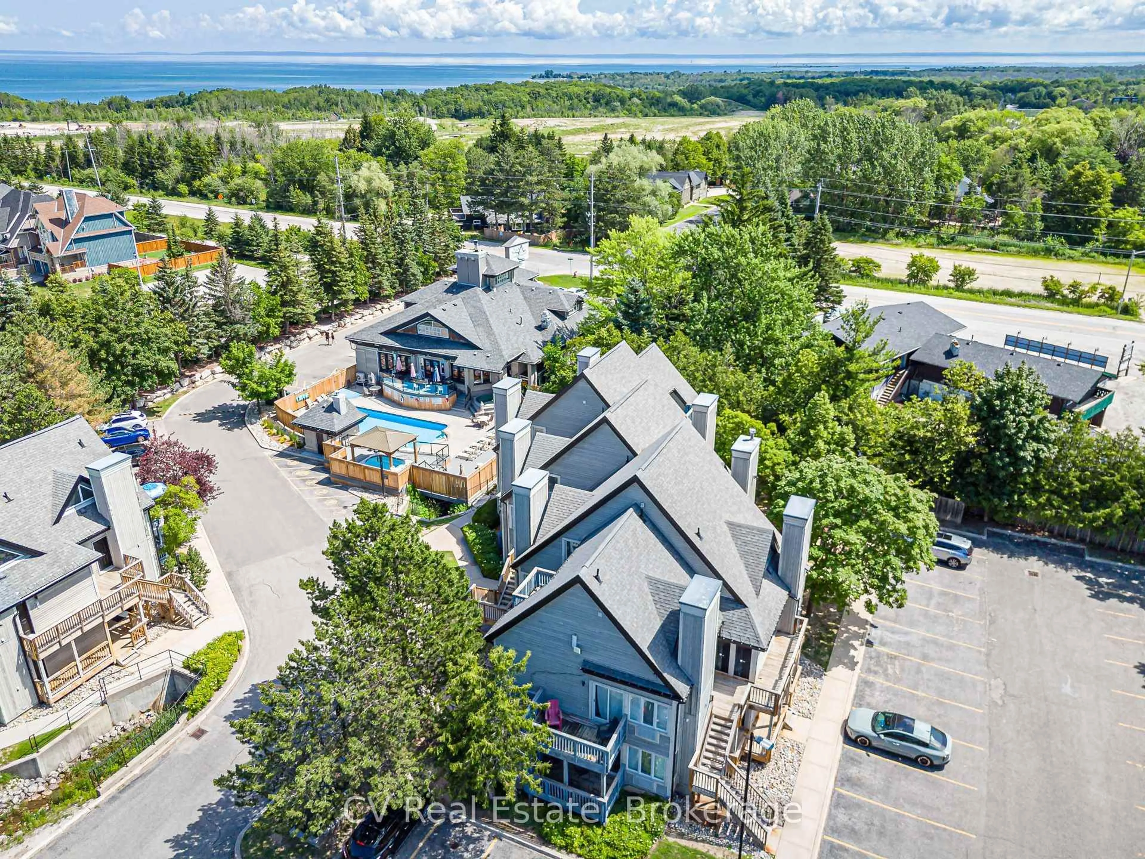 A pic from outside/outdoor area/front of a property/back of a property/a pic from drone, water/lake/river/ocean view for 796468 Grey 19 Rd #404, Blue Mountains Ontario L9Y 0N6