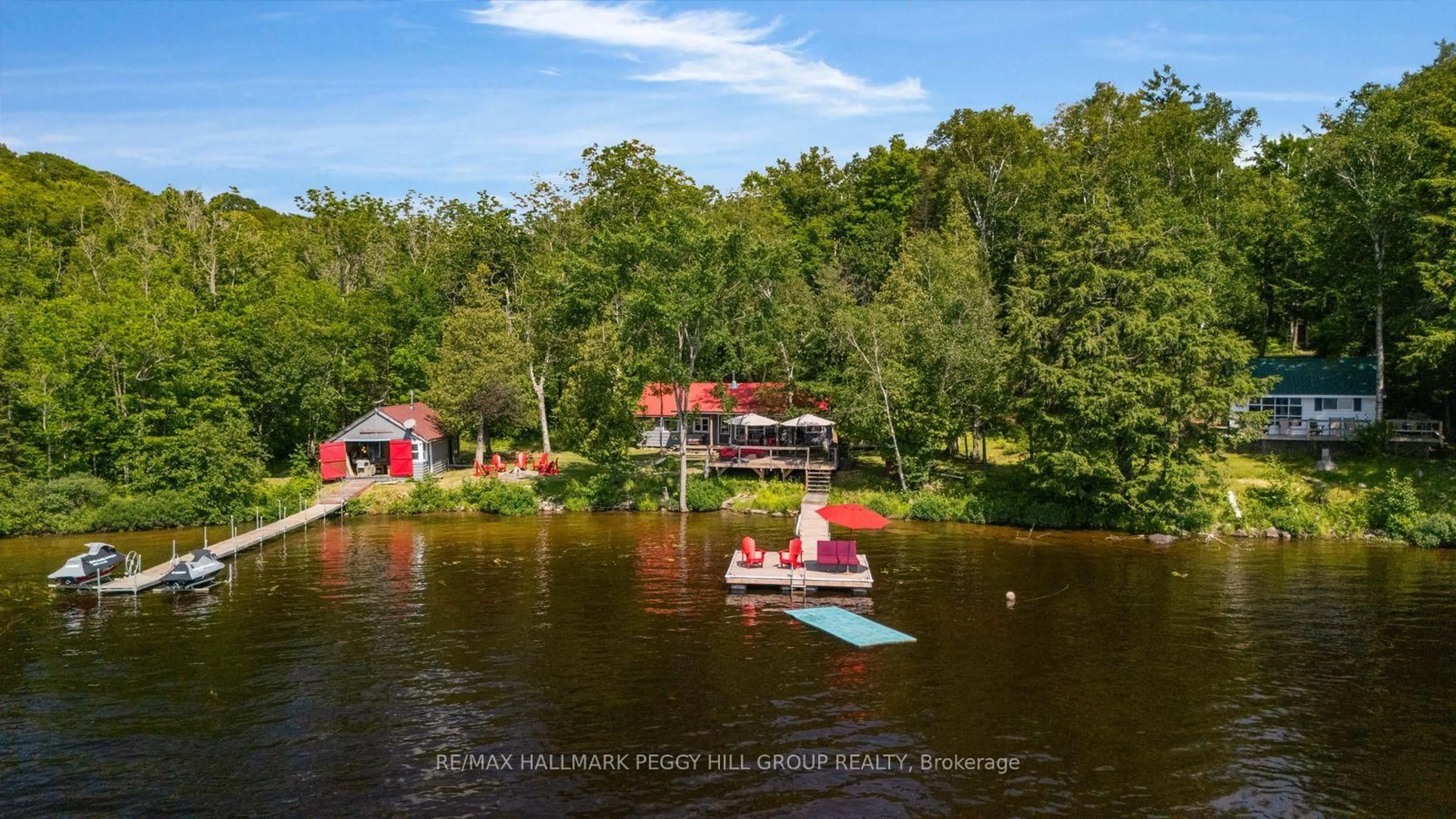 A pic from outside/outdoor area/front of a property/back of a property/a pic from drone, water/lake/river/ocean view for 200 Doe Lake Peninsula, Armour Ontario P0A 1L0