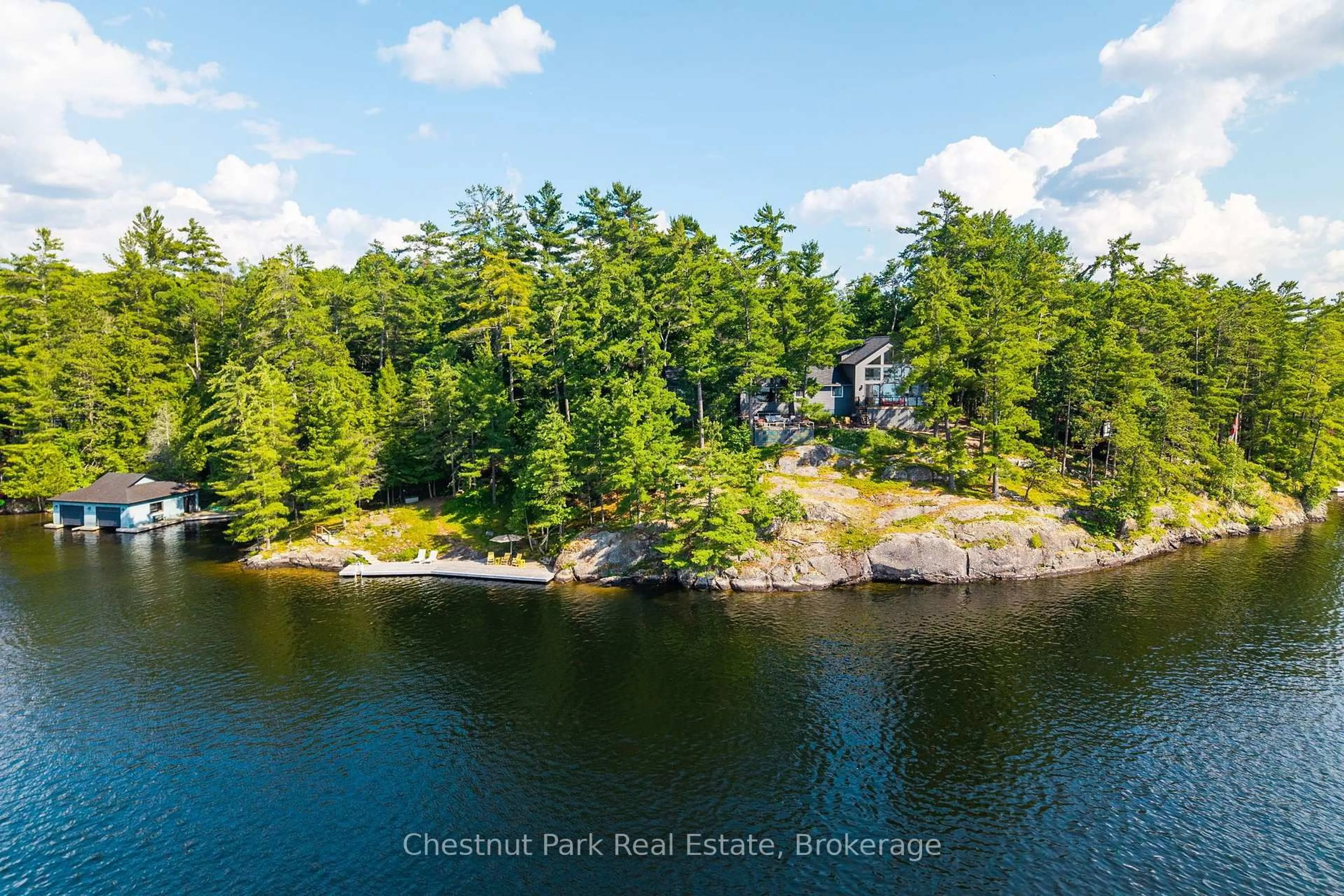A pic from outside/outdoor area/front of a property/back of a property/a pic from drone, water/lake/river/ocean view for 1218 Purdy Rd, Muskoka Lakes Ontario P0B 1P0