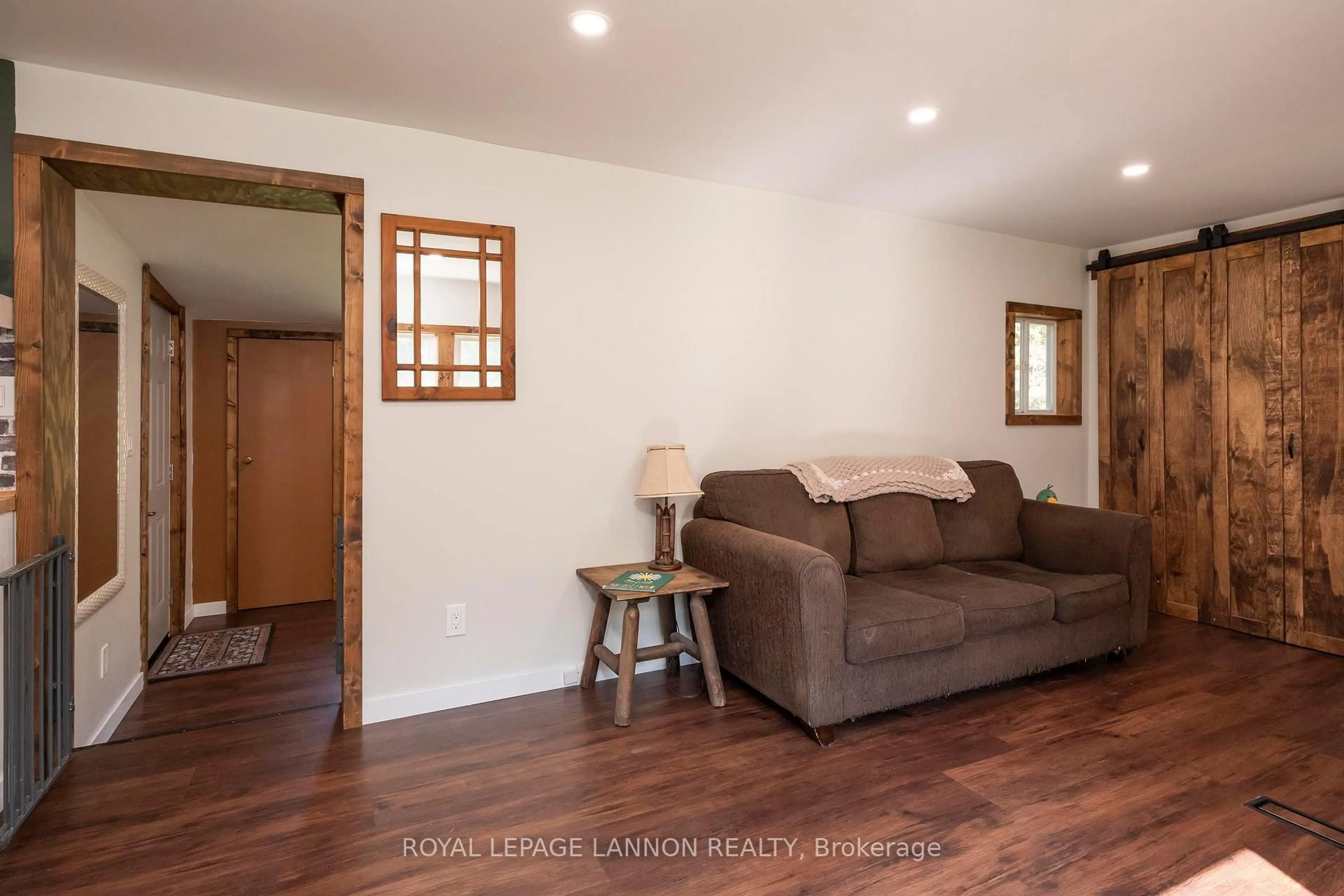 Living room with furniture, wood/laminate floor for 20 Union School Rd, Neebing Ontario P7L 0E7