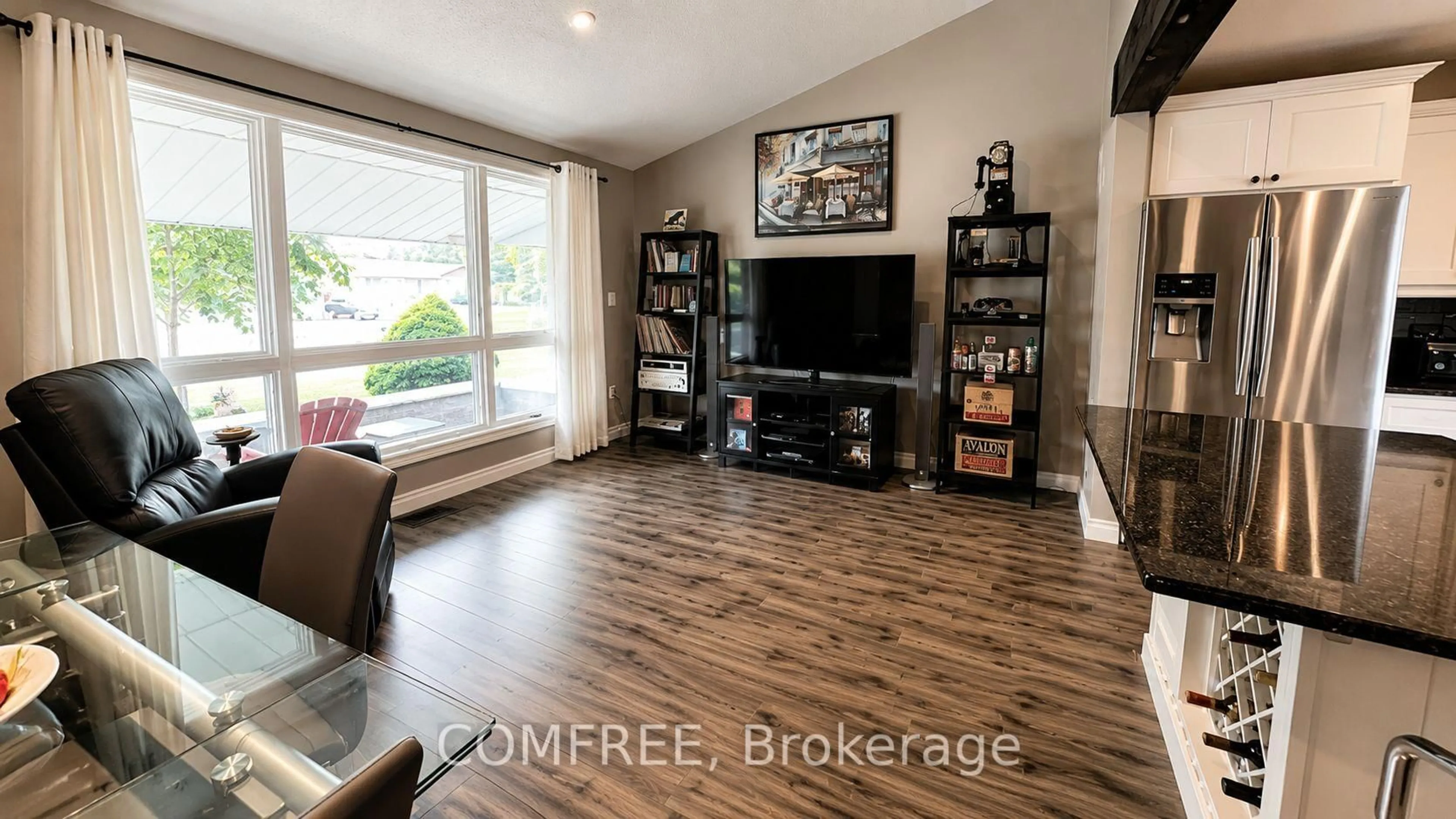 Living room with furniture, wood/laminate floor for 275 Margaret St, Middlesex Centre Ontario N0P 2L0