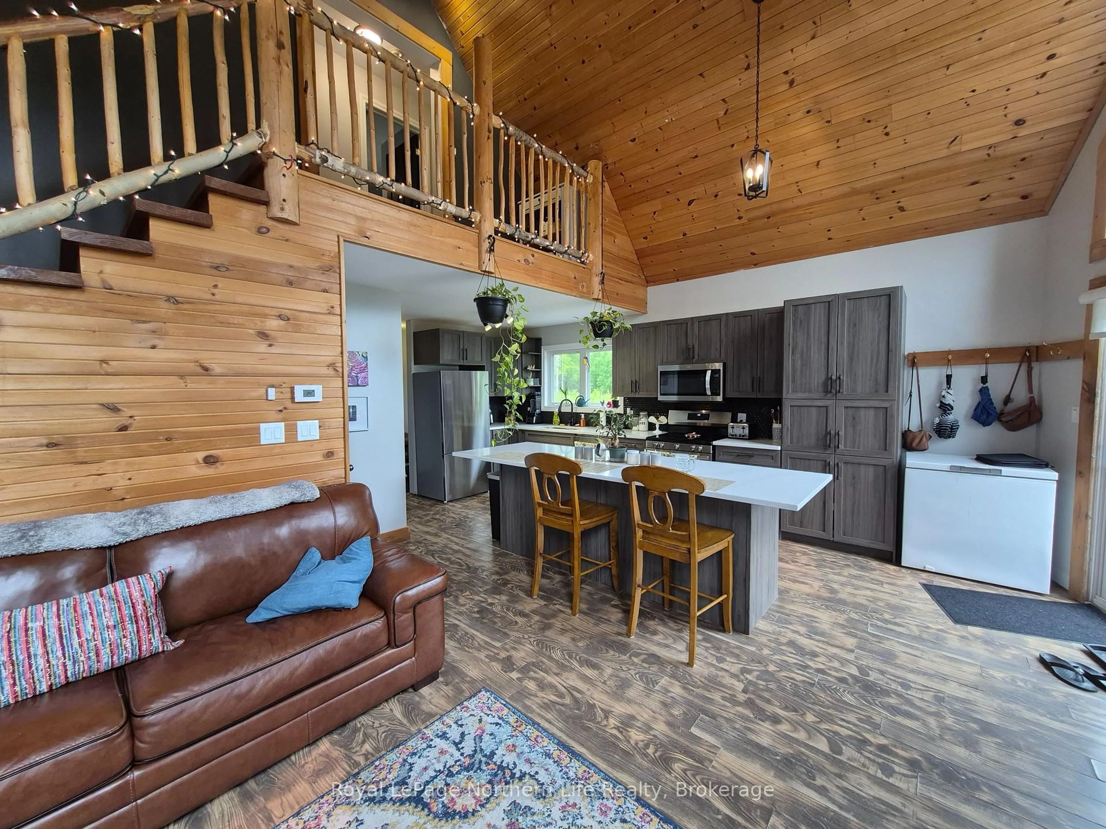 Open concept kitchen, wood/laminate floor for 1856 Papineau Rd, Papineau-Cameron Ontario P0H 1V0