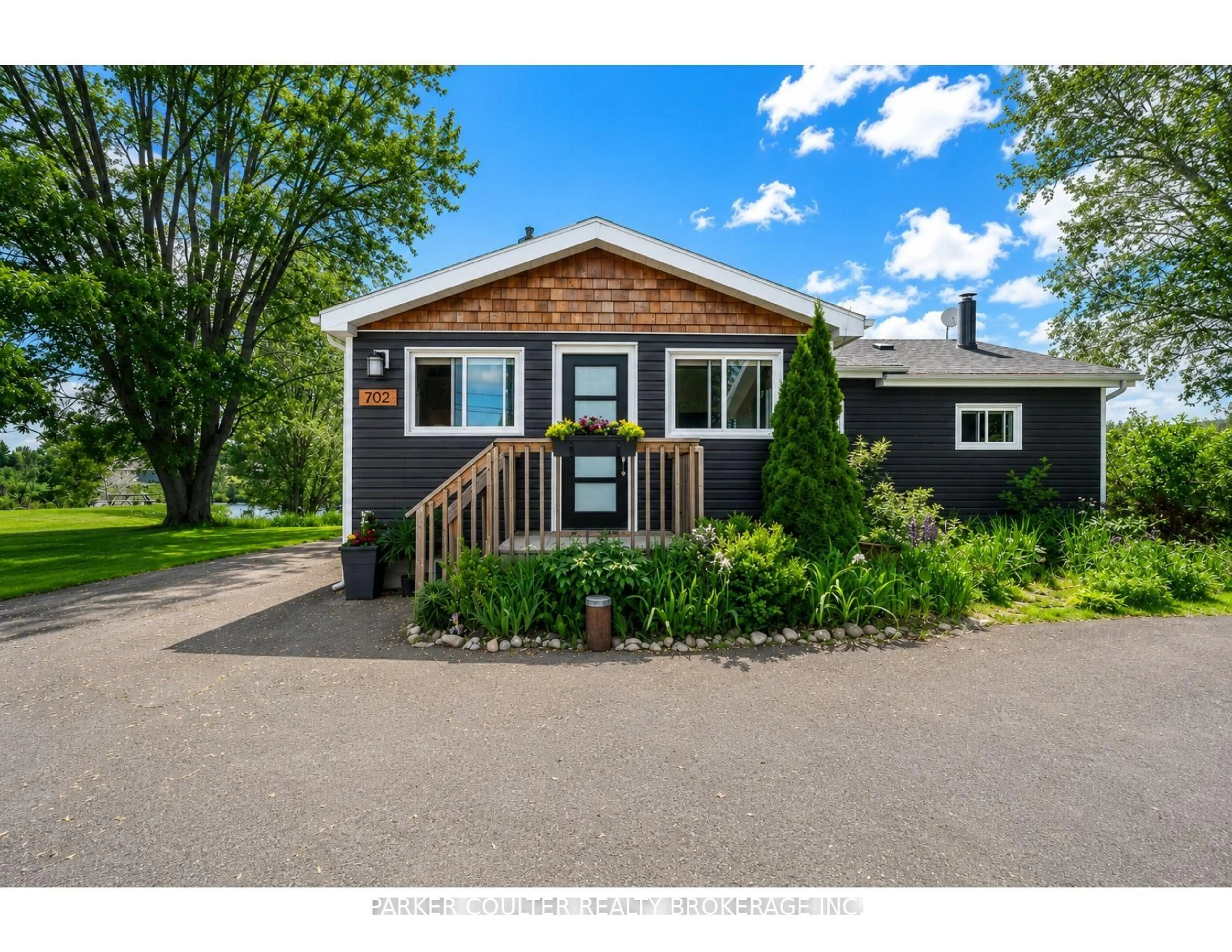 Home with vinyl exterior material, street for 702 Highway 124, McKellar Ontario P0G 1C0