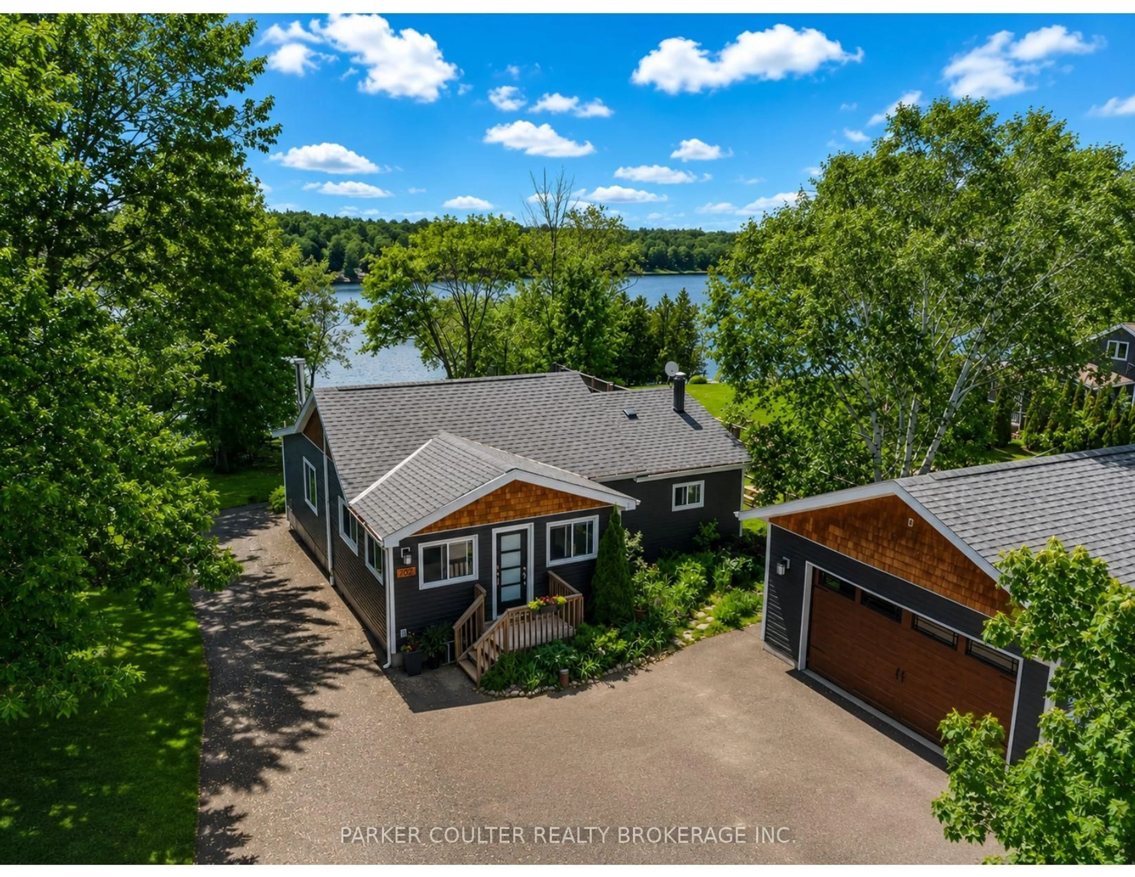 A pic from outside/outdoor area/front of a property/back of a property/a pic from drone, water/lake/river/ocean view for 702 Highway 124, McKellar Ontario P0G 1C0