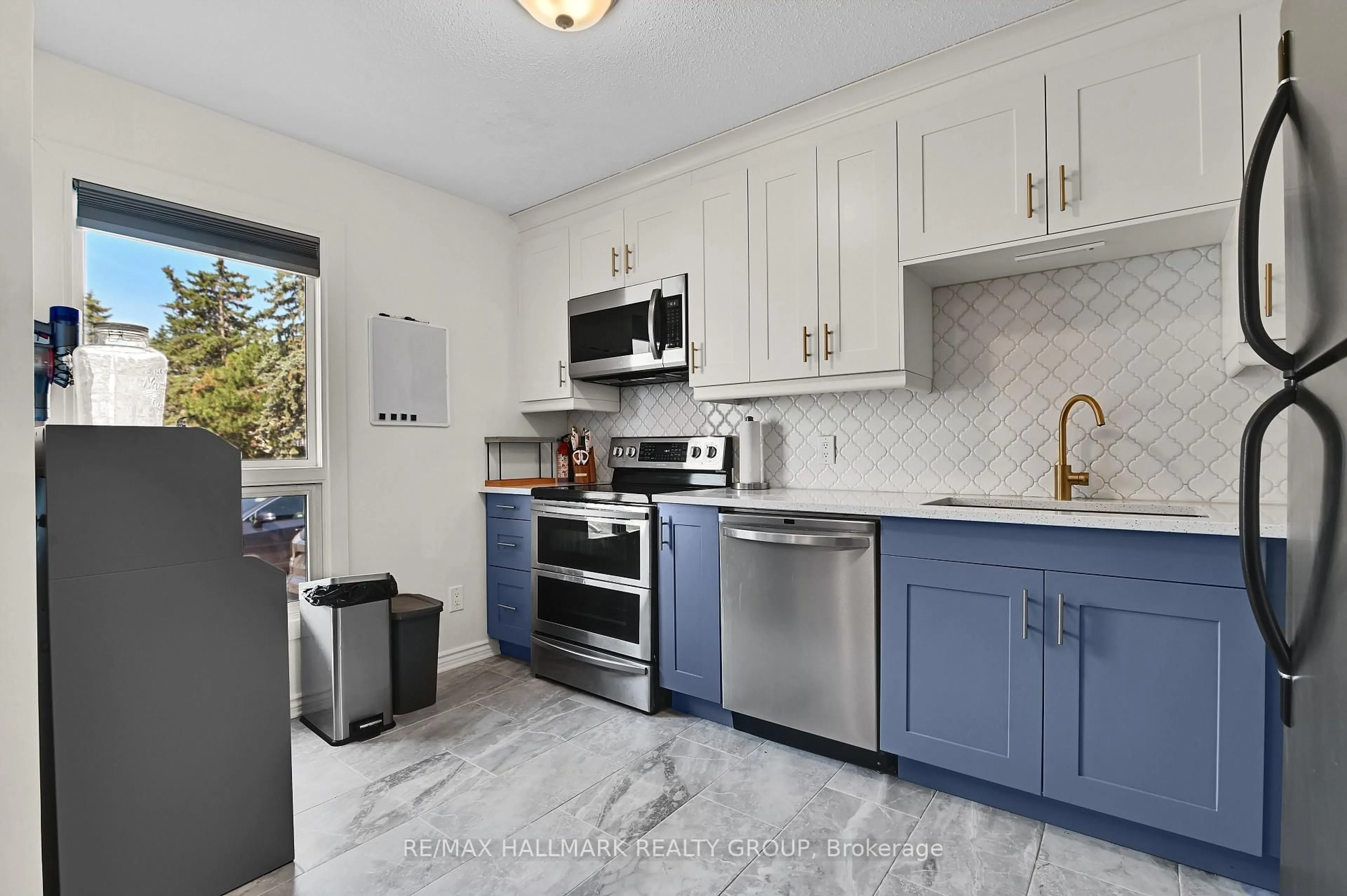 Open concept kitchen, ceramic/tile floor for 1505 Ballard Crt #3, Ottawa Ontario K1B 4Z1