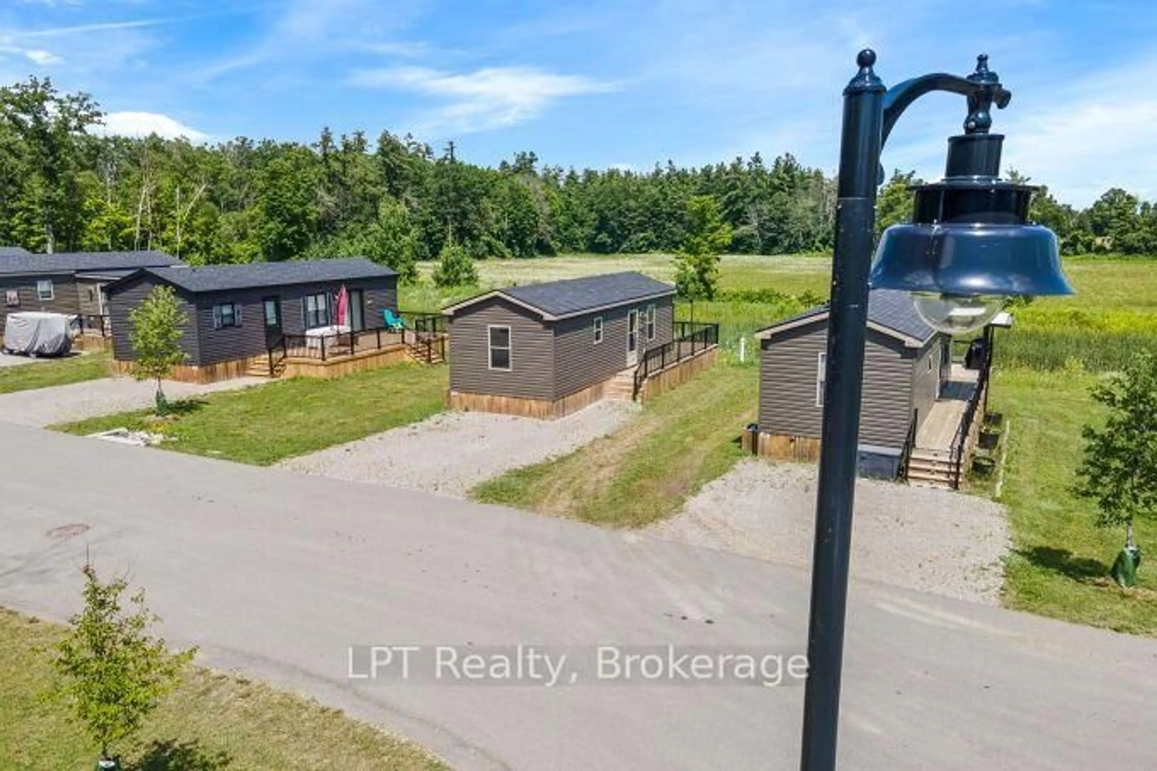 A pic from outside/outdoor area/front of a property/back of a property/a pic from drone, unknown for 1235 Villiers Line #LBA047, Otonabee-South Monaghan Ontario K0L 2G0