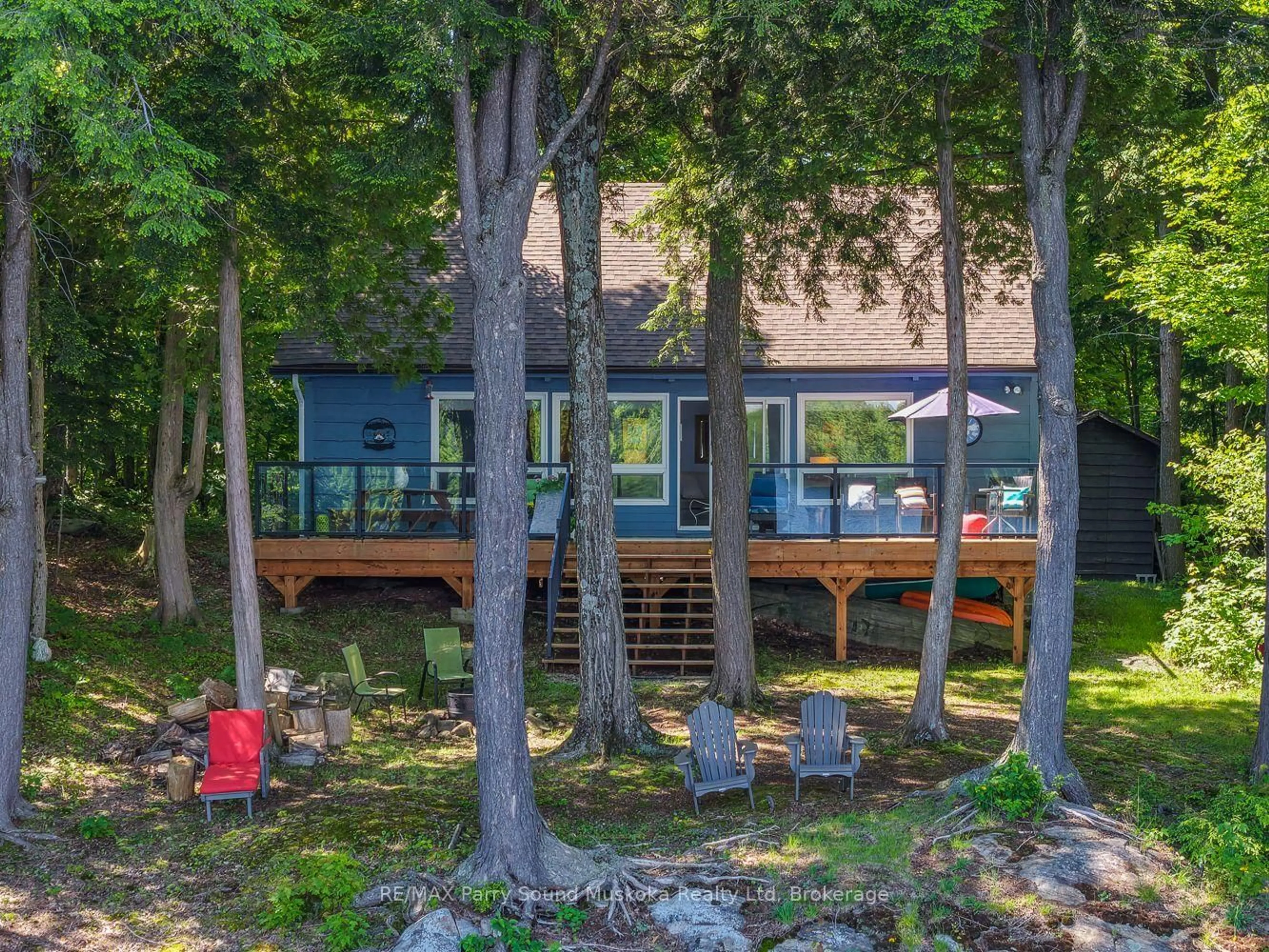 A pic from outside/outdoor area/front of a property/back of a property/a pic from drone, forest/trees view for 2 South Point Dr, McKellar Ontario P2A 0B4