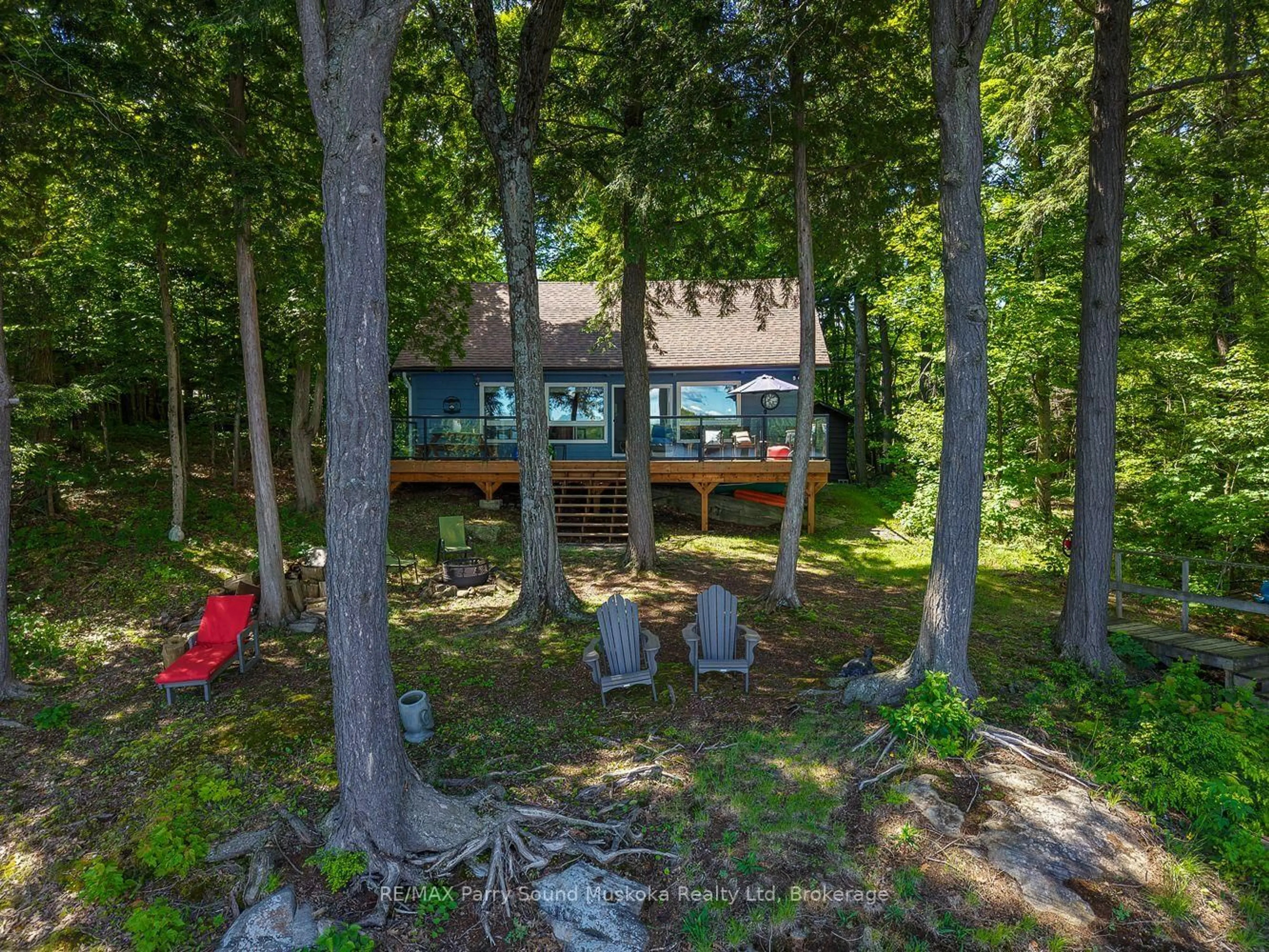 A pic from outside/outdoor area/front of a property/back of a property/a pic from drone, forest/trees view for 2 South Point Dr, McKellar Ontario P2A 0B4