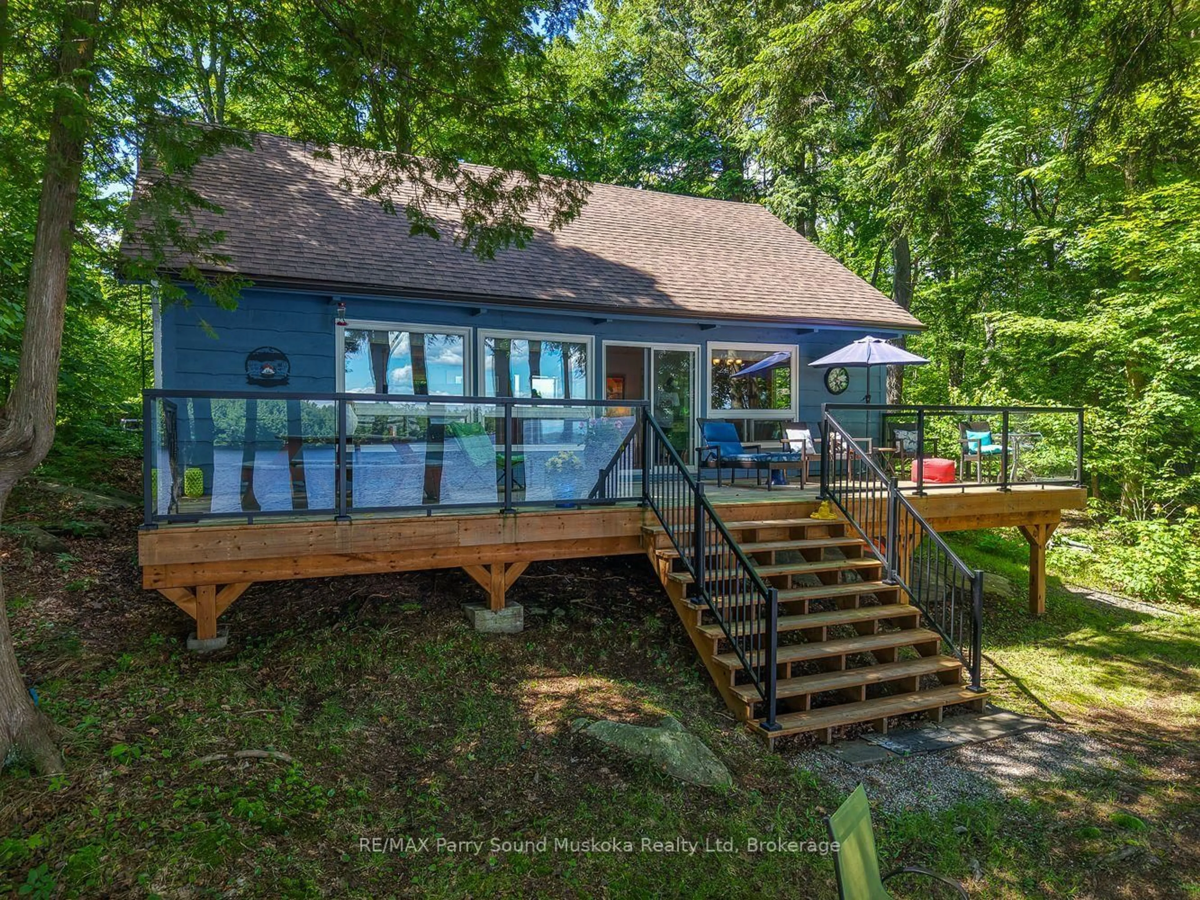 A pic from outside/outdoor area/front of a property/back of a property/a pic from drone, water/lake/river/ocean view for 2 South Point Dr, McKellar Ontario P2A 0B4