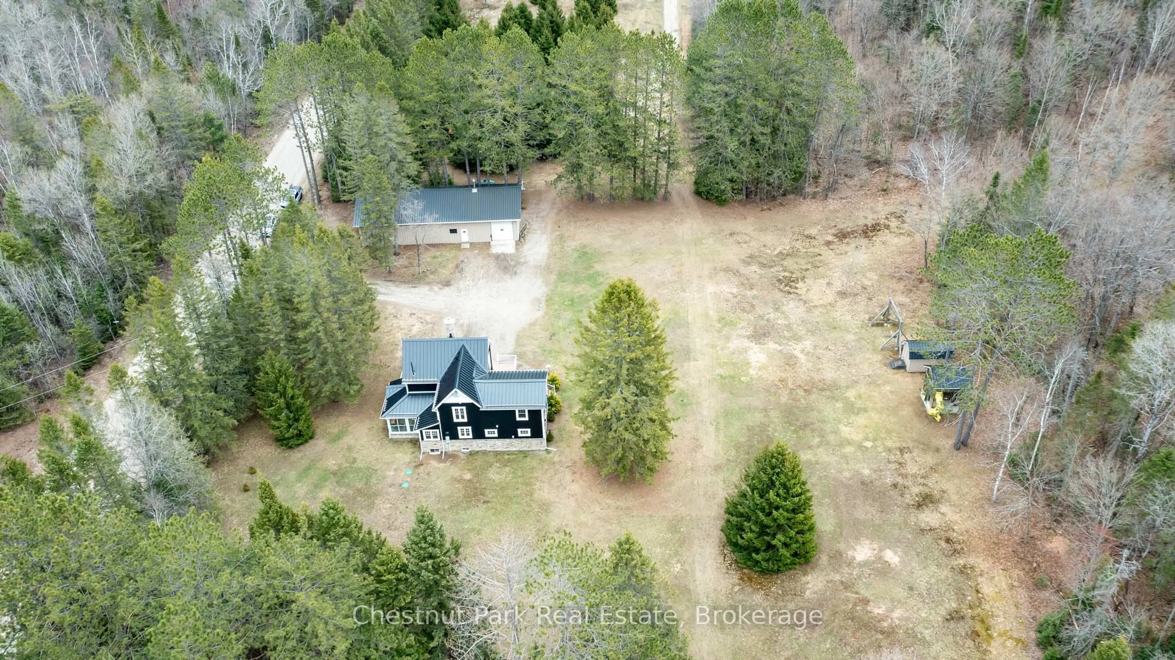 A pic from outside/outdoor area/front of a property/back of a property/a pic from drone, forest/trees view for 12 Emsdale Lake Rd, Perry Ontario P0A 1M0