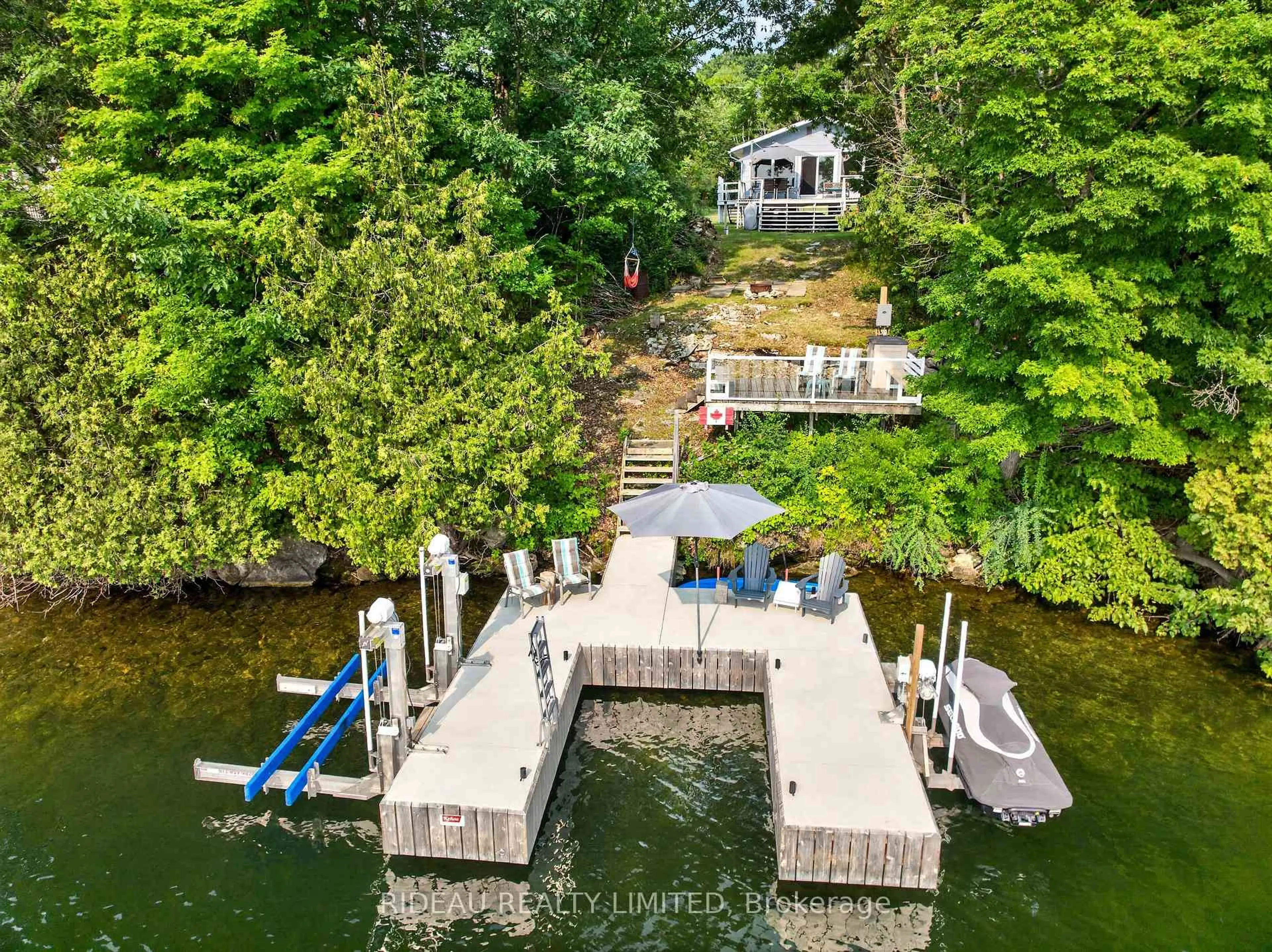 A pic from outside/outdoor area/front of a property/back of a property/a pic from drone, water/lake/river/ocean view for 231 McBride Point Dr, Rideau Lakes Ontario K0G 1X0