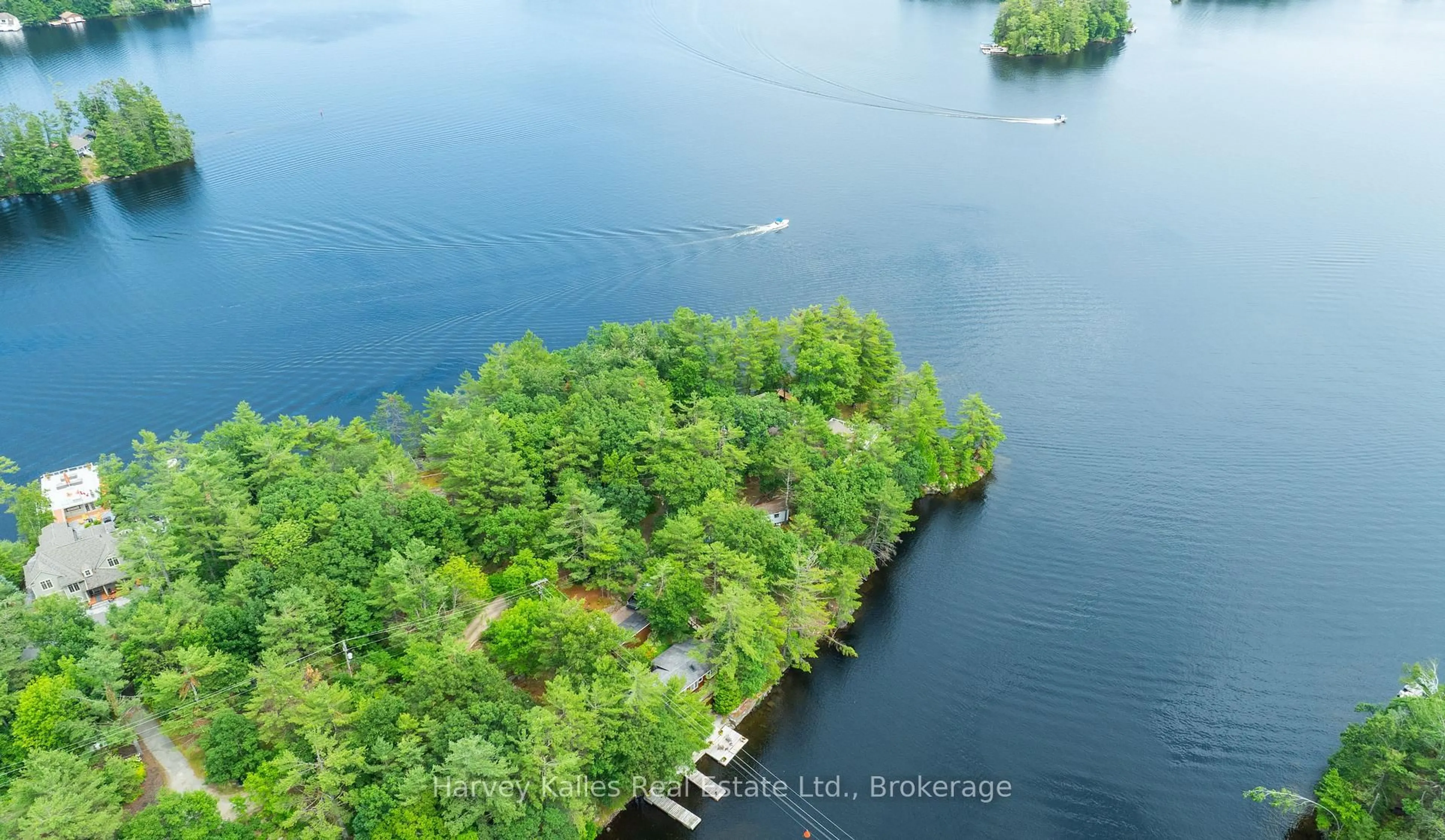 A pic from outside/outdoor area/front of a property/back of a property/a pic from drone, water/lake/river/ocean view for 1078 Mckenzie Rd, Muskoka Lakes Ontario P1P 1A4
