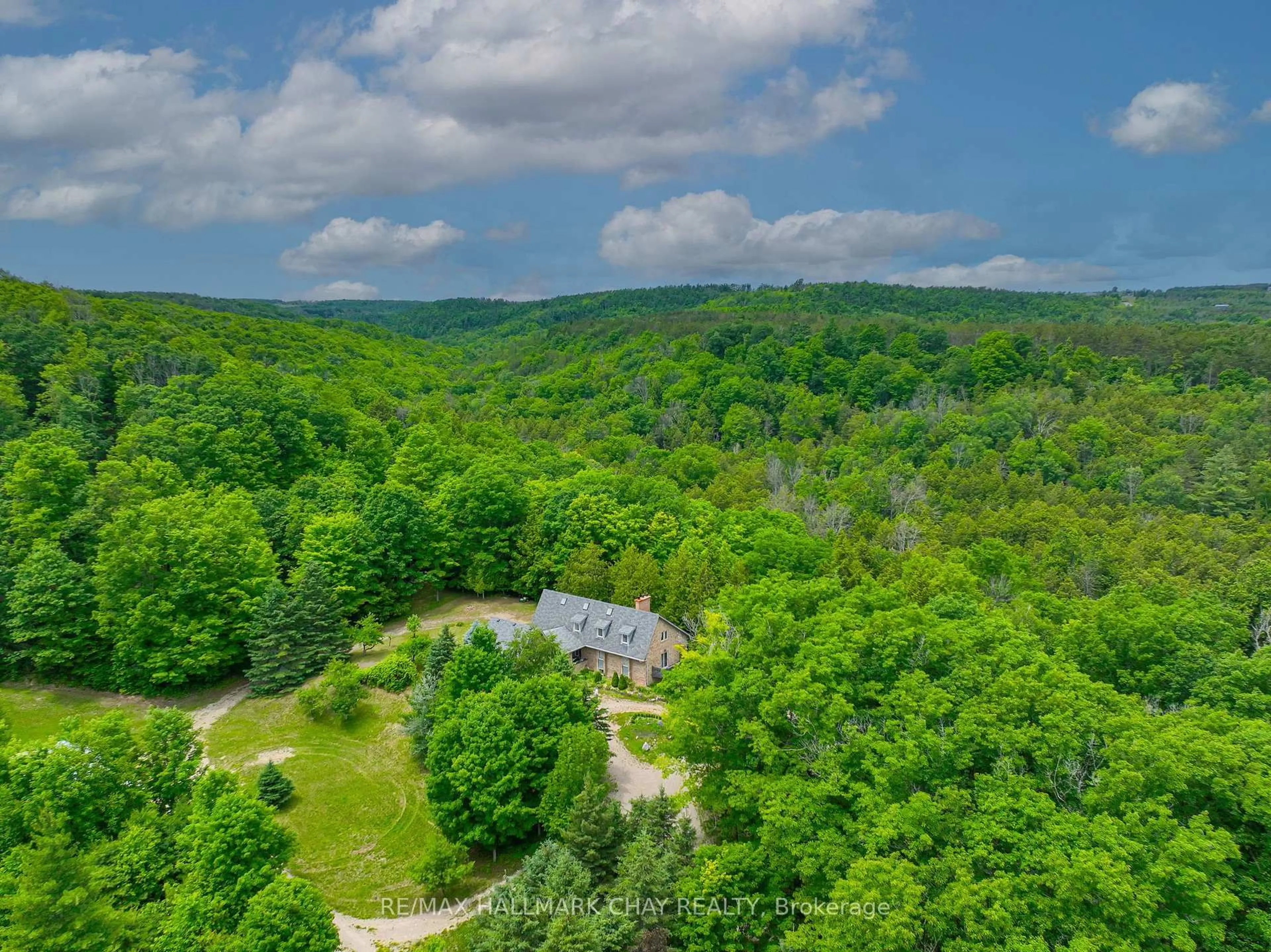 A pic from outside/outdoor area/front of a property/back of a property/a pic from drone, forest/trees view for 718078 1st Line East Line, Mulmur Ontario L9V 0G3