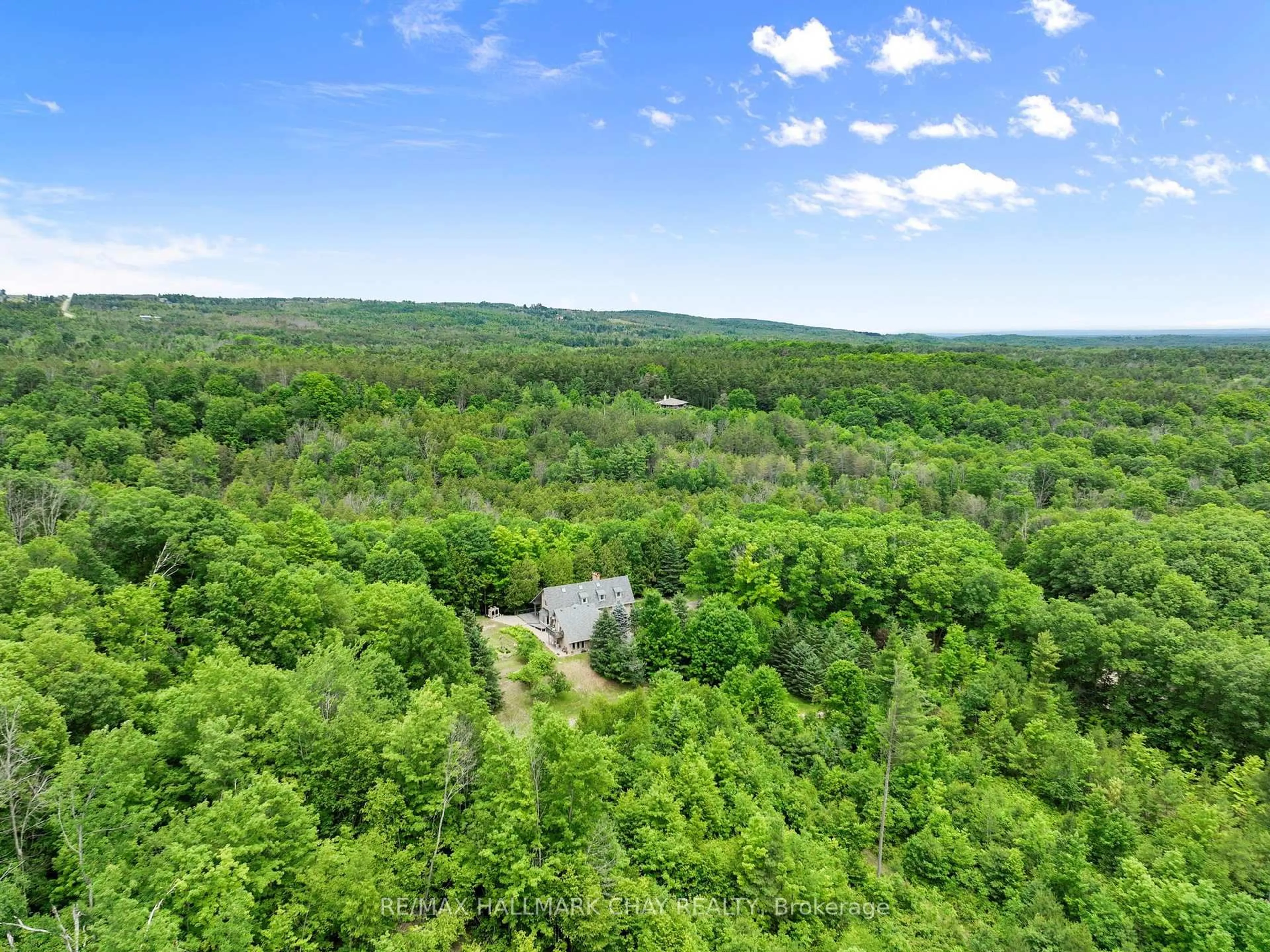 A pic from outside/outdoor area/front of a property/back of a property/a pic from drone, forest/trees view for 718078 1st Line East Line, Mulmur Ontario L9V 0G3