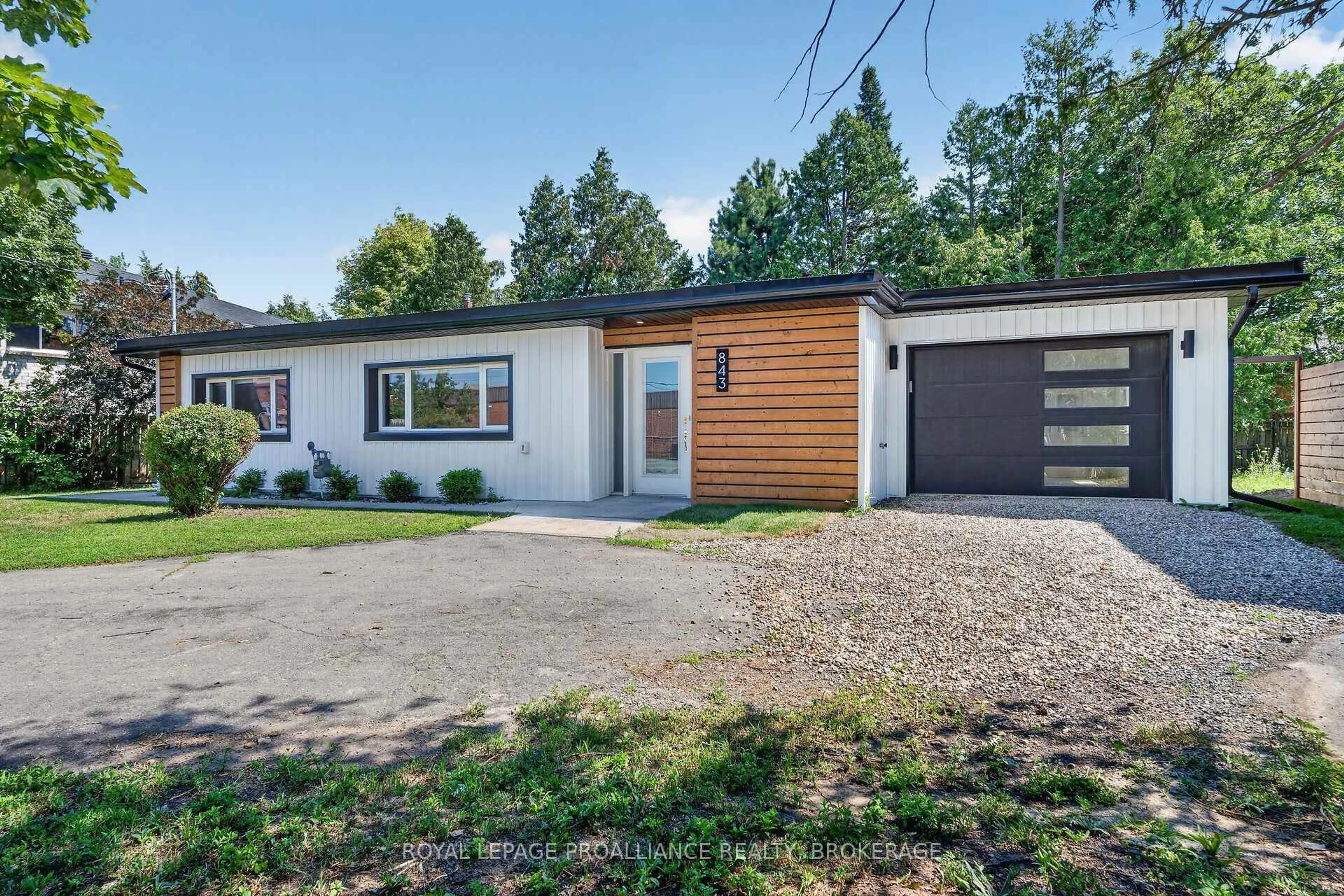Home with vinyl exterior material, street for 843 Woodbine Rd, Kingston Ontario K7P 2X3