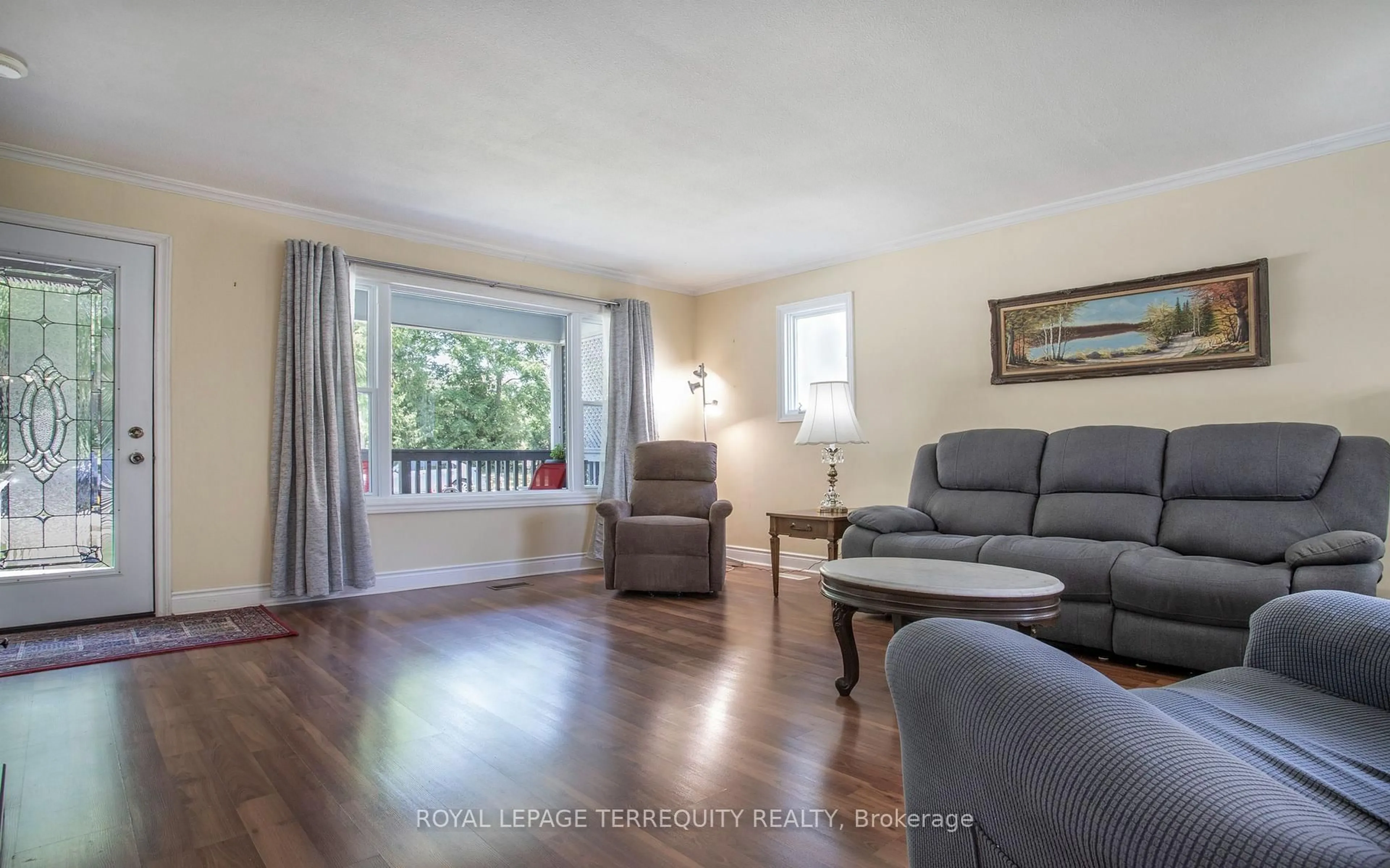 Living room with furniture, wood/laminate floor for 24 Simcoe St, Kawartha Lakes Ontario K9V 2G4