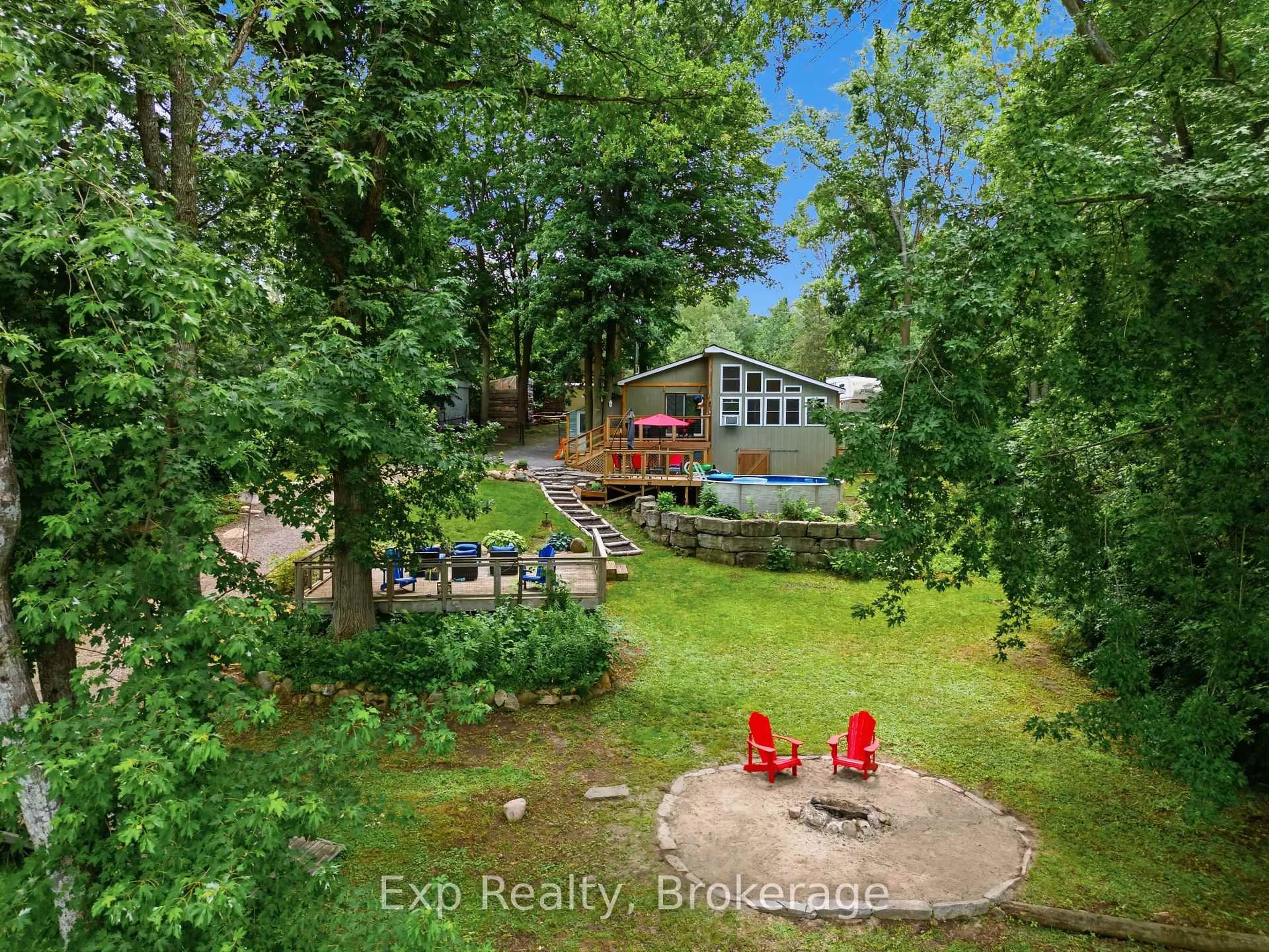 A pic from outside/outdoor area/front of a property/back of a property/a pic from drone, water/lake/river/ocean view for 131 Cottage Lane, Belleville Ontario K0K 2V0