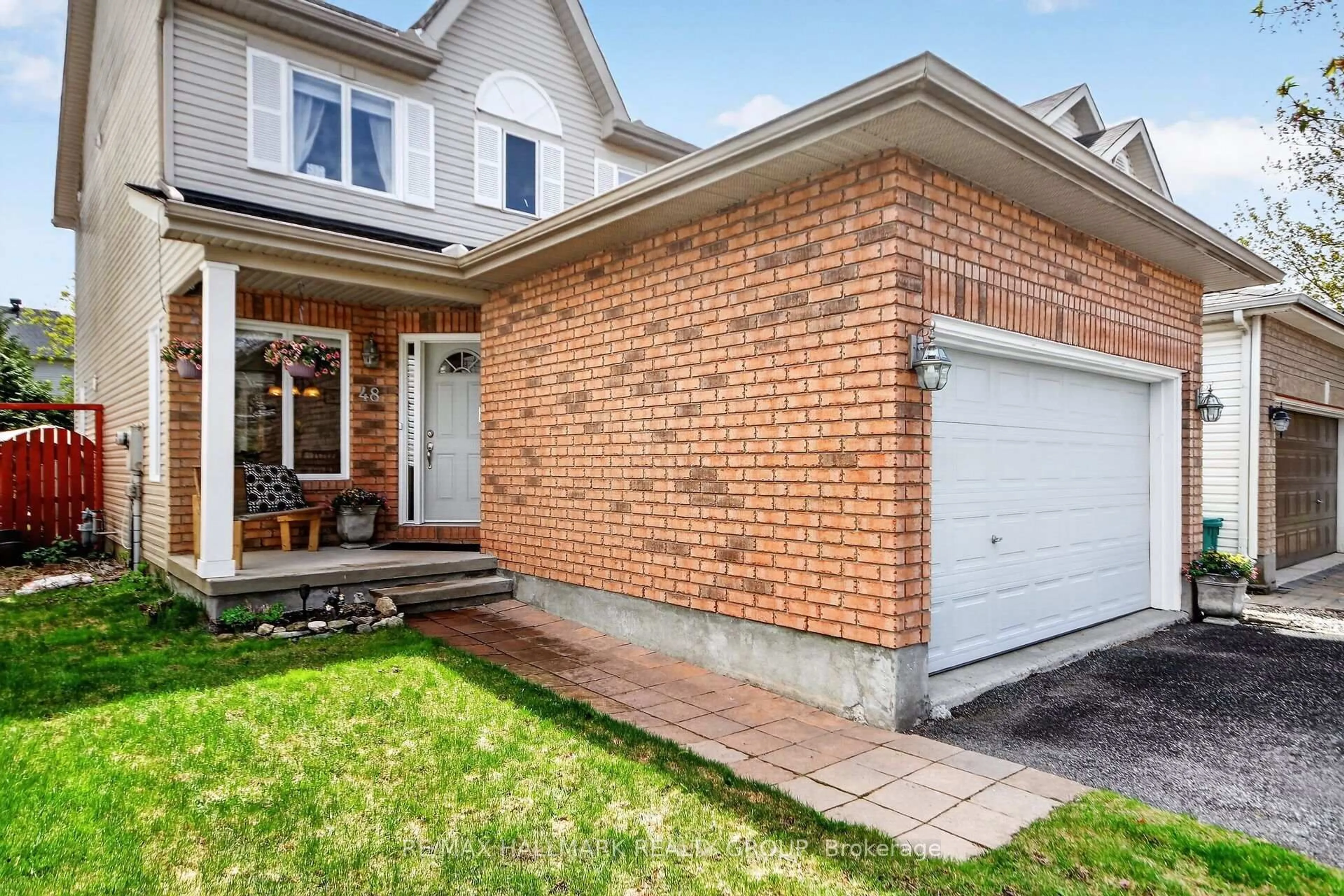 Home with brick exterior material, street for 48 Avonmore Cres, Ottawa Ontario K2G 6J7