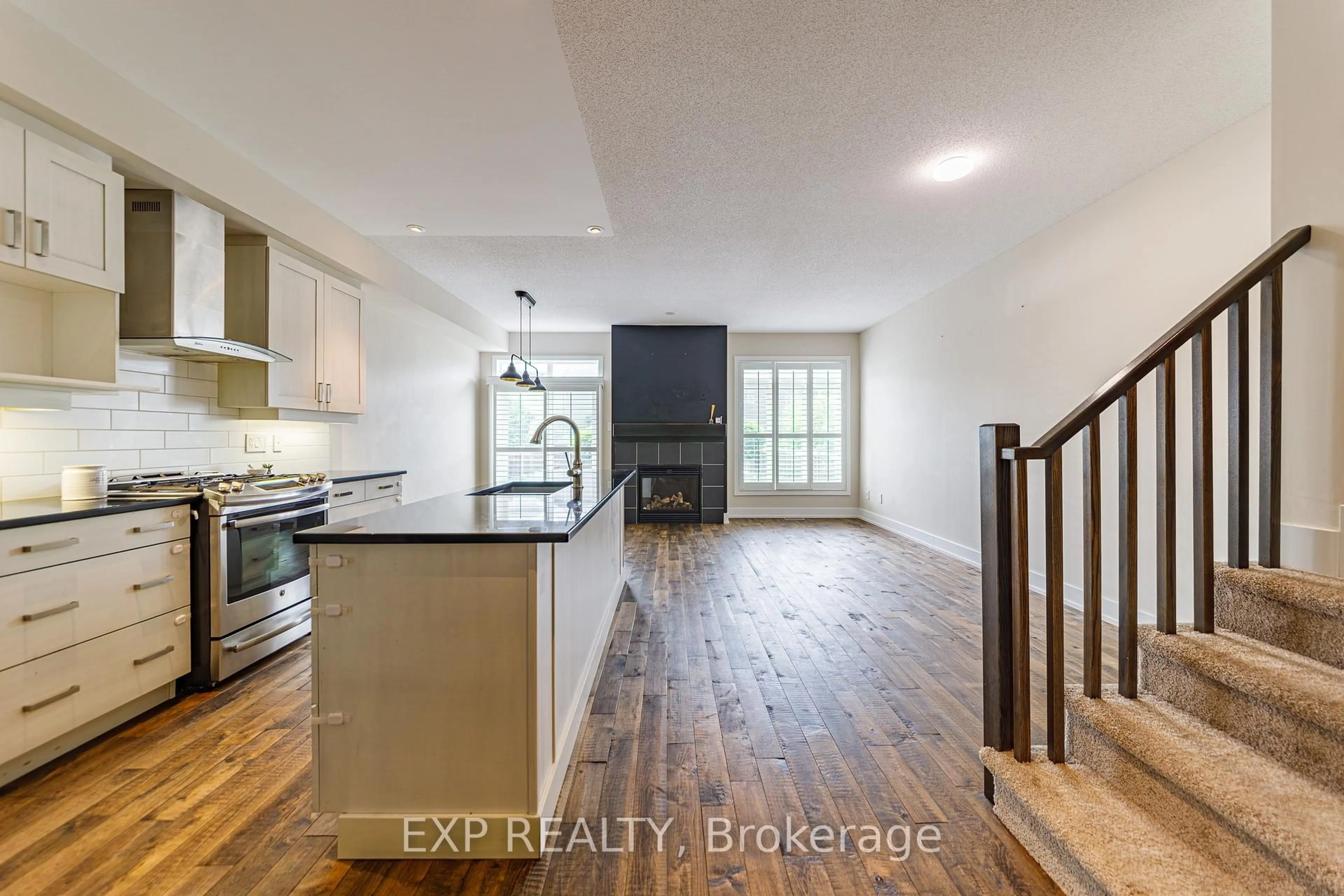 Open concept kitchen, wood/laminate floor for 605 Tennant Way, Ottawa Ontario K4M 0C6