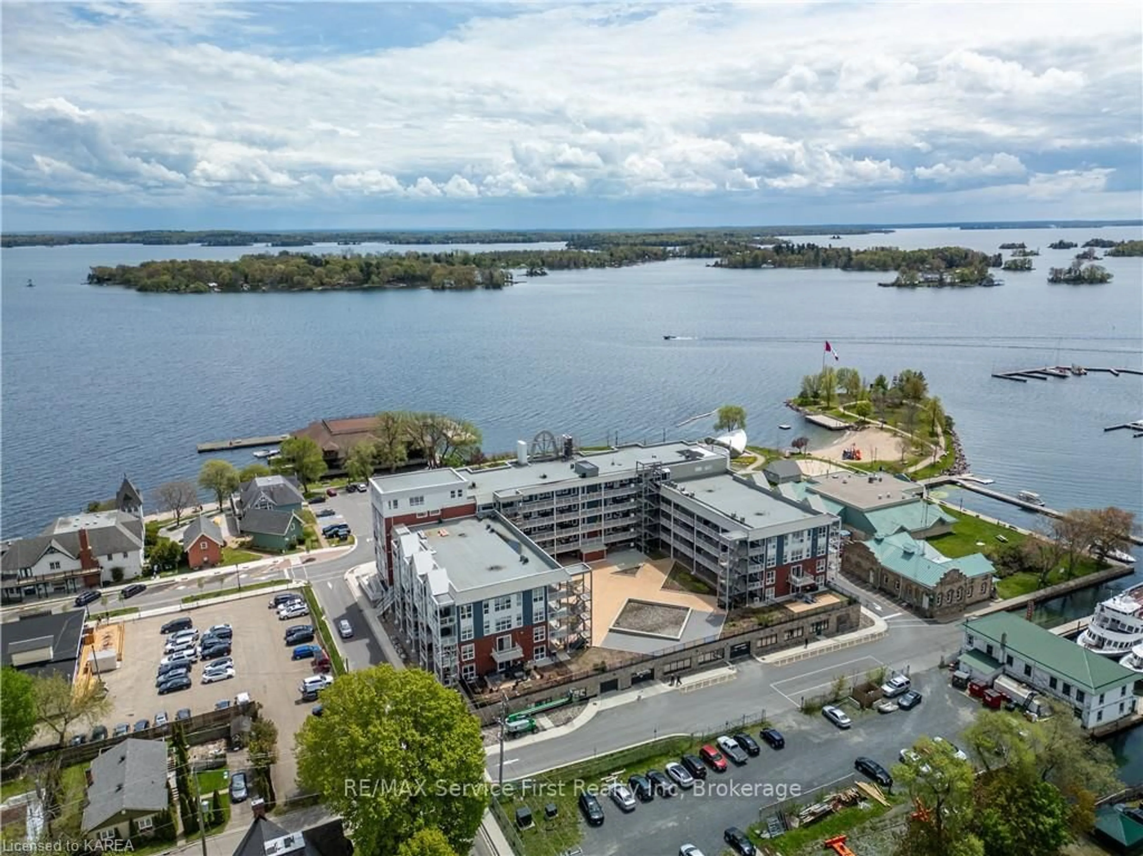 A pic from outside/outdoor area/front of a property/back of a property/a pic from drone, water/lake/river/ocean view for 130 WATER St #206, Gananoque Ontario K7G 2C4