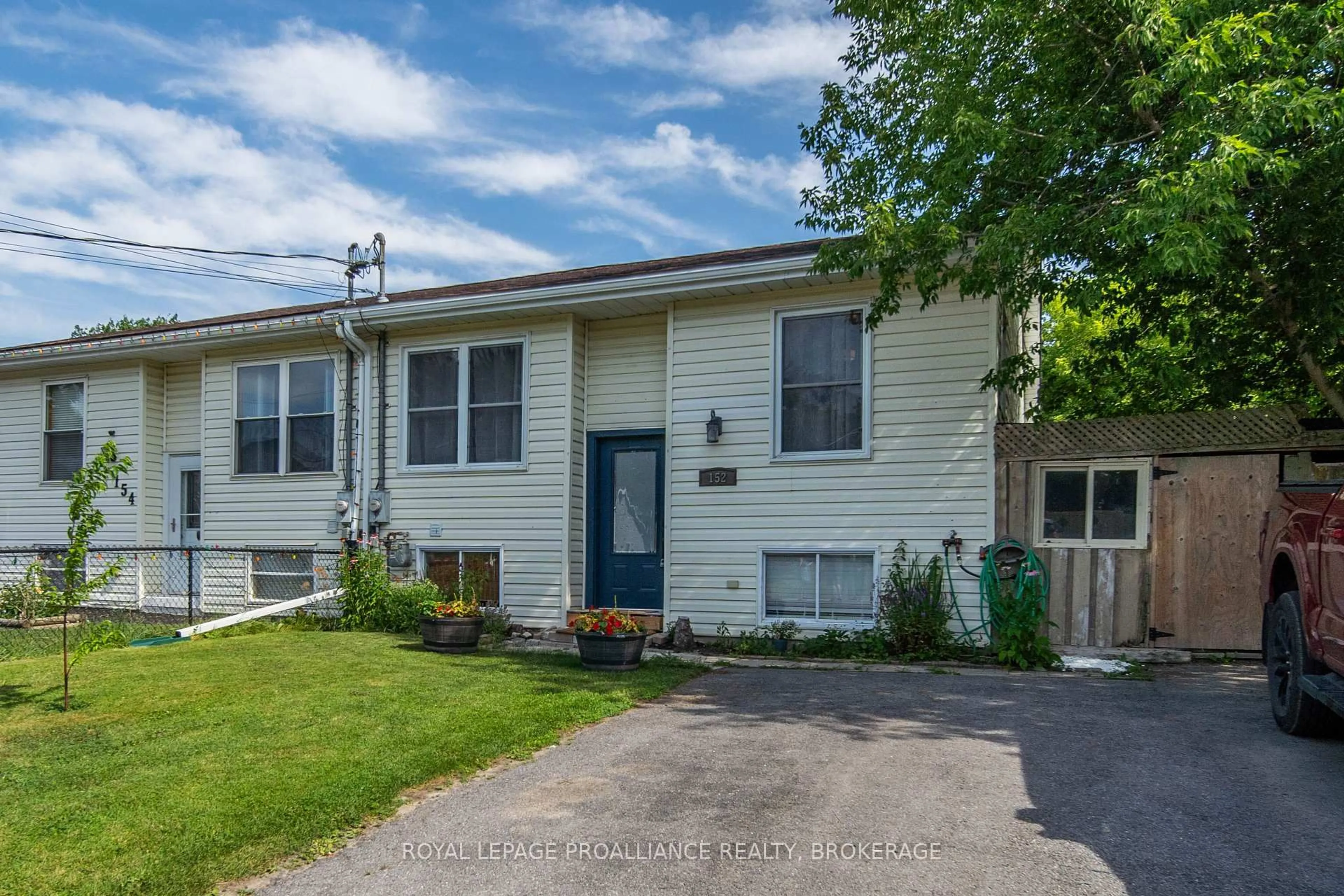 Home with vinyl exterior material, street for 152 Purdy Rd, Bath Ontario K0H 1G0