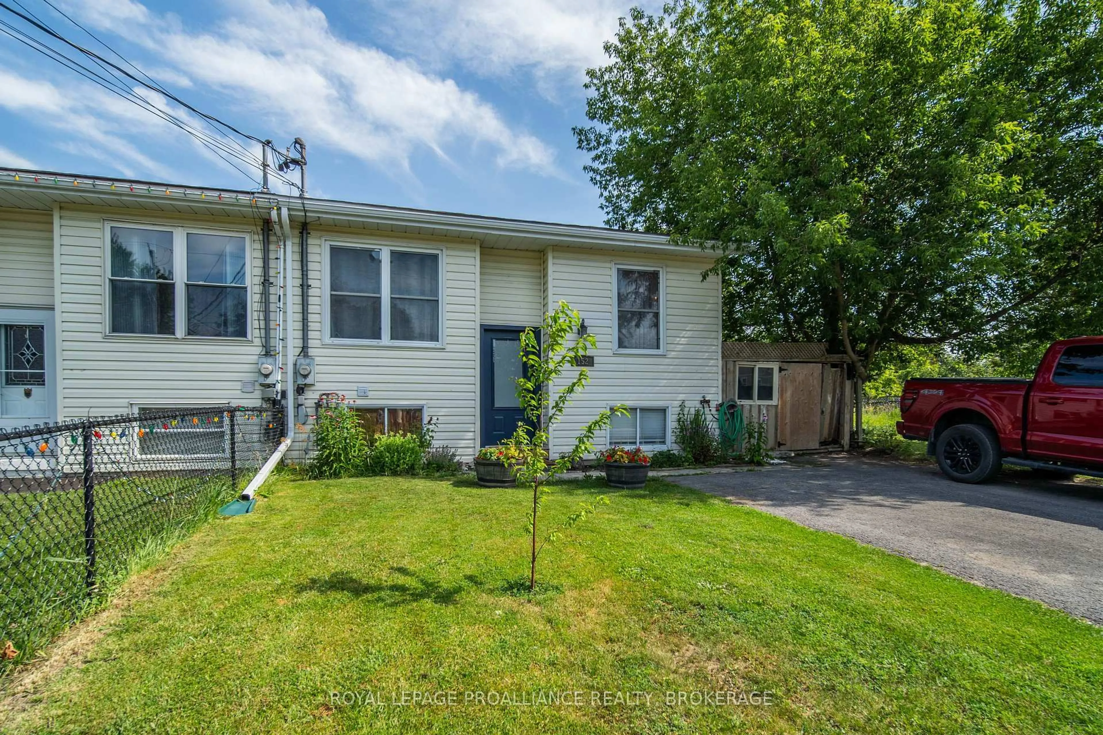 Home with vinyl exterior material, street for 152 Purdy Rd, Bath Ontario K0H 1G0