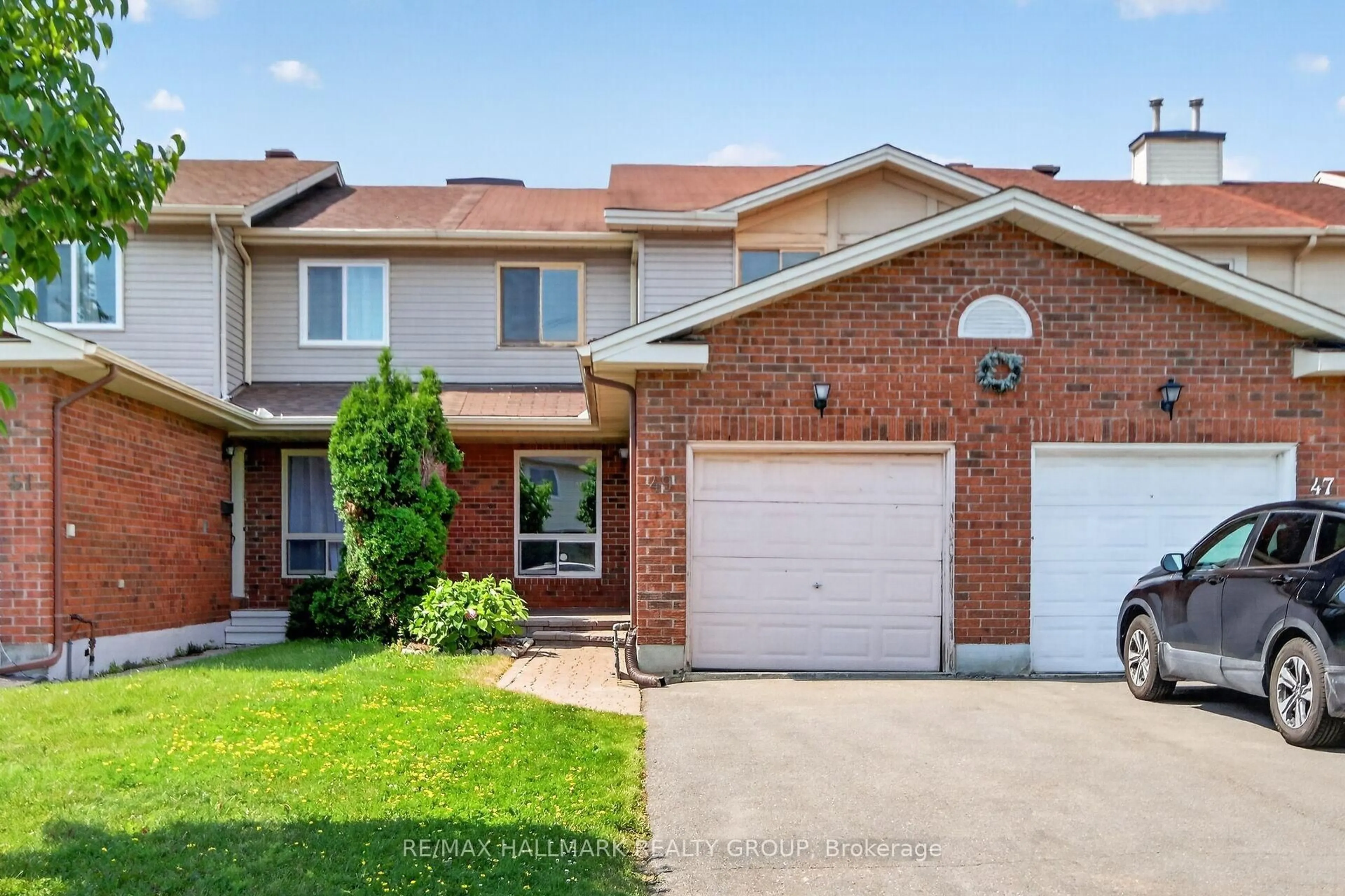 Home with brick exterior material, street for 49 Newport Cres, Ottawa Ontario K1T 3M2
