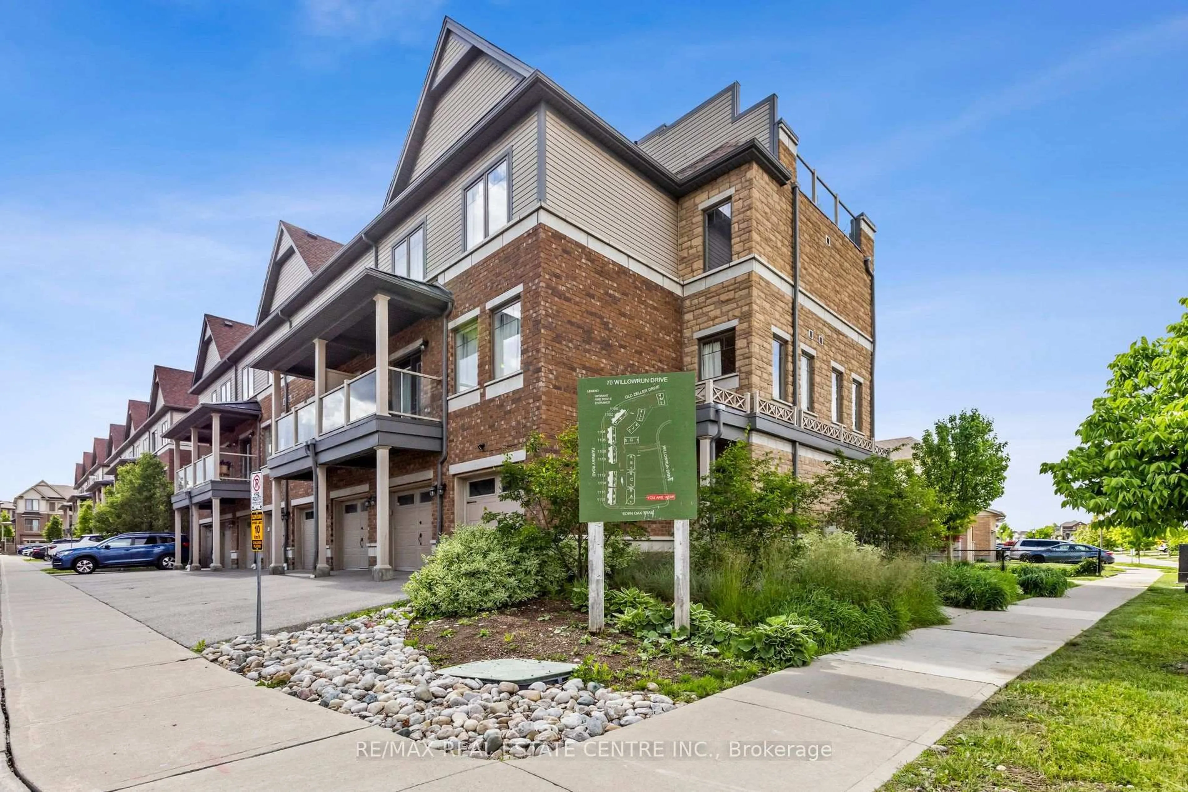 Home with brick exterior material, street for 70 Willowrun Dr #A1, Kitchener Ontario N2A 0J3