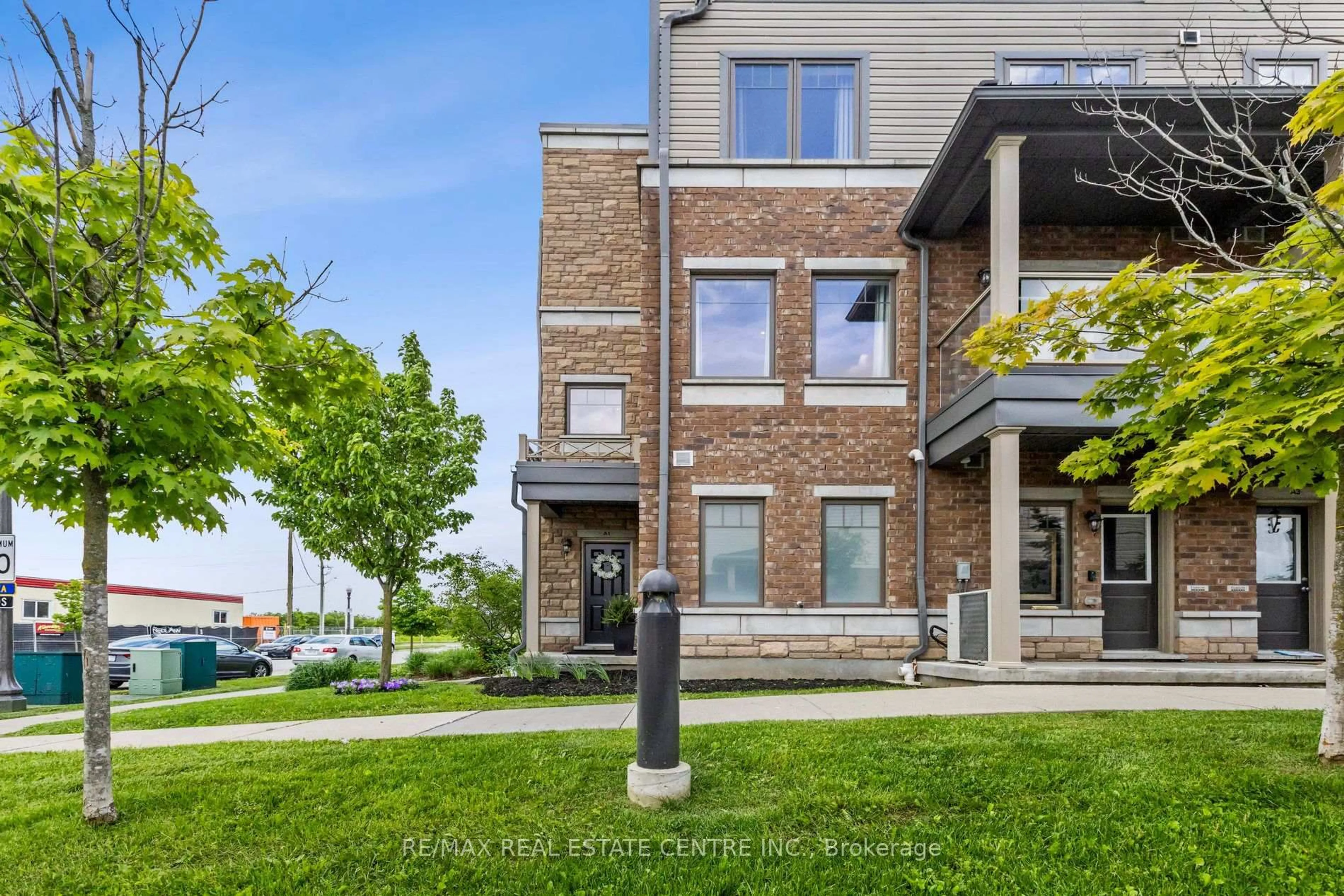 Home with brick exterior material, street for 70 Willowrun Dr #A1, Kitchener Ontario N2A 0J3