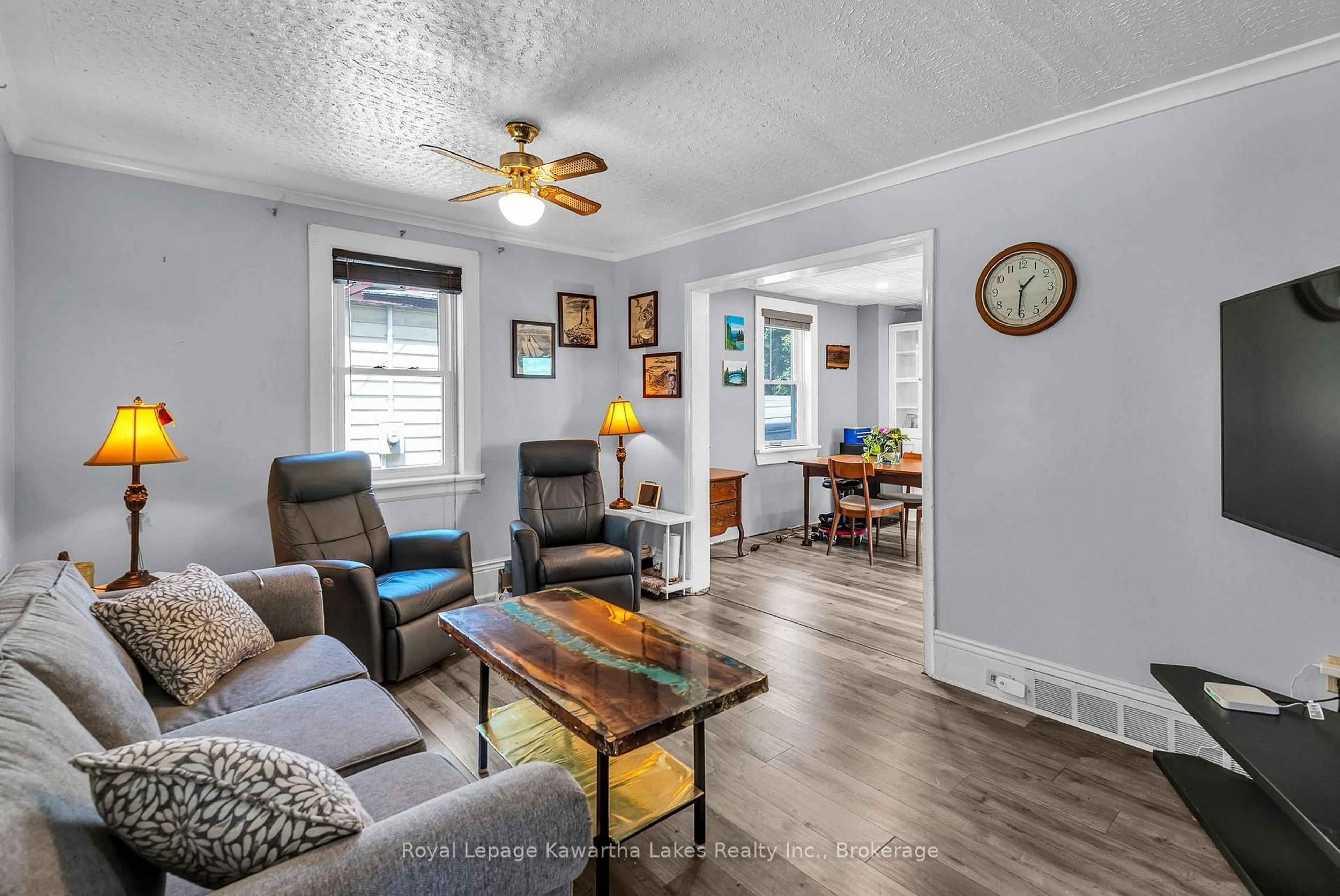 Living room with furniture, wood/laminate floor for 6 Wolfe St, Kawartha Lakes Ontario K9V 2H9